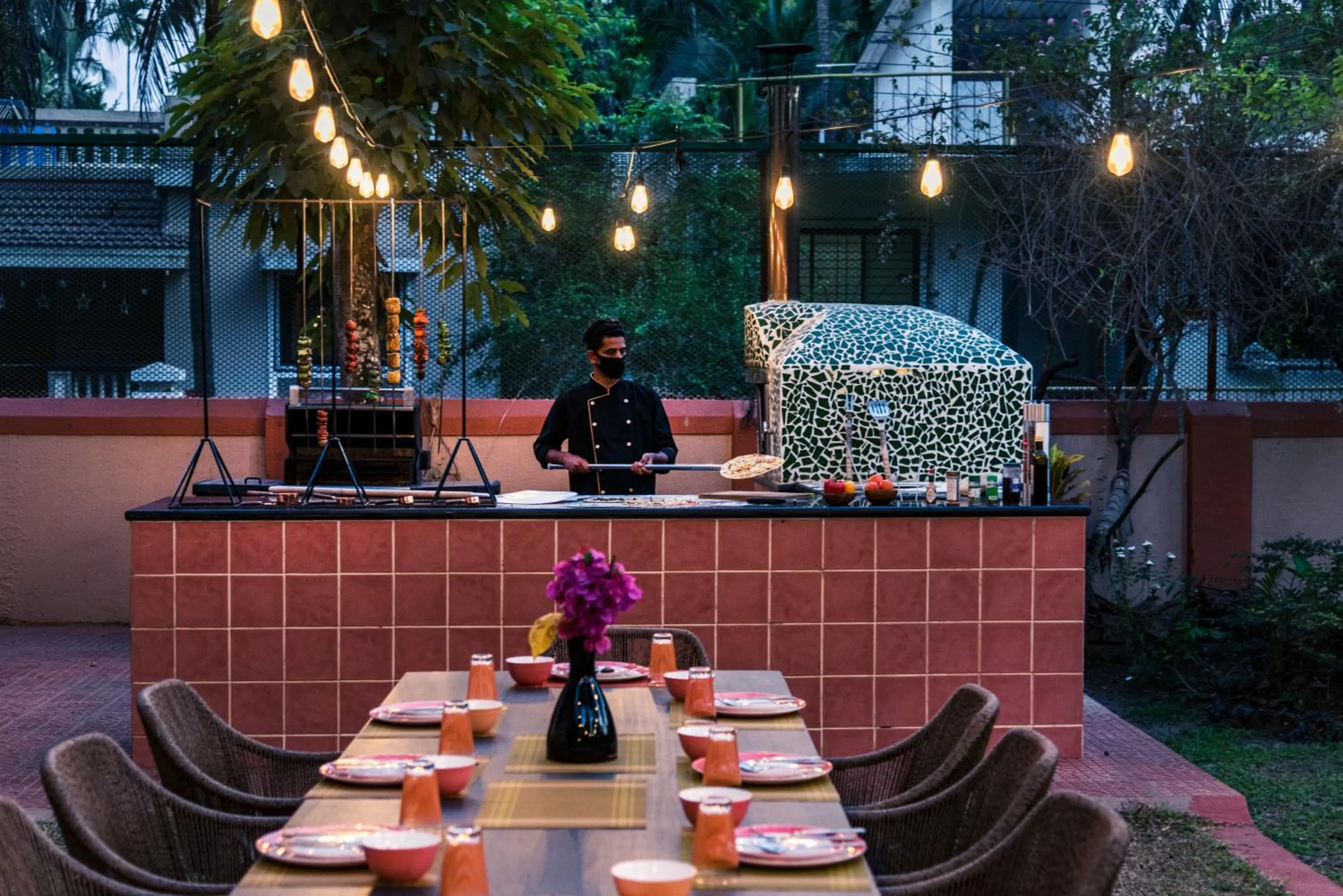 Staff in SaffronStays Casa Del Palms - 8BR luxury pool villa with gazebo, pickleball, bar & lawns near Nagaon Beach