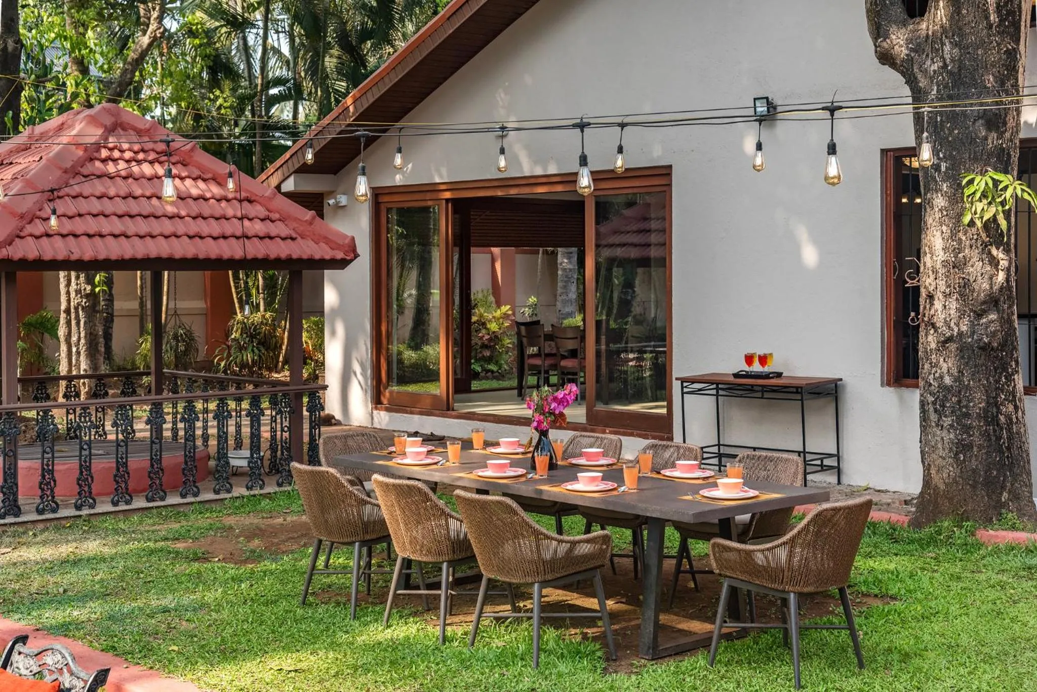 Property building in SaffronStays Casa Del Palms - 8BR luxury pool villa with gazebo, pickleball, bar & lawns near Nagaon Beach