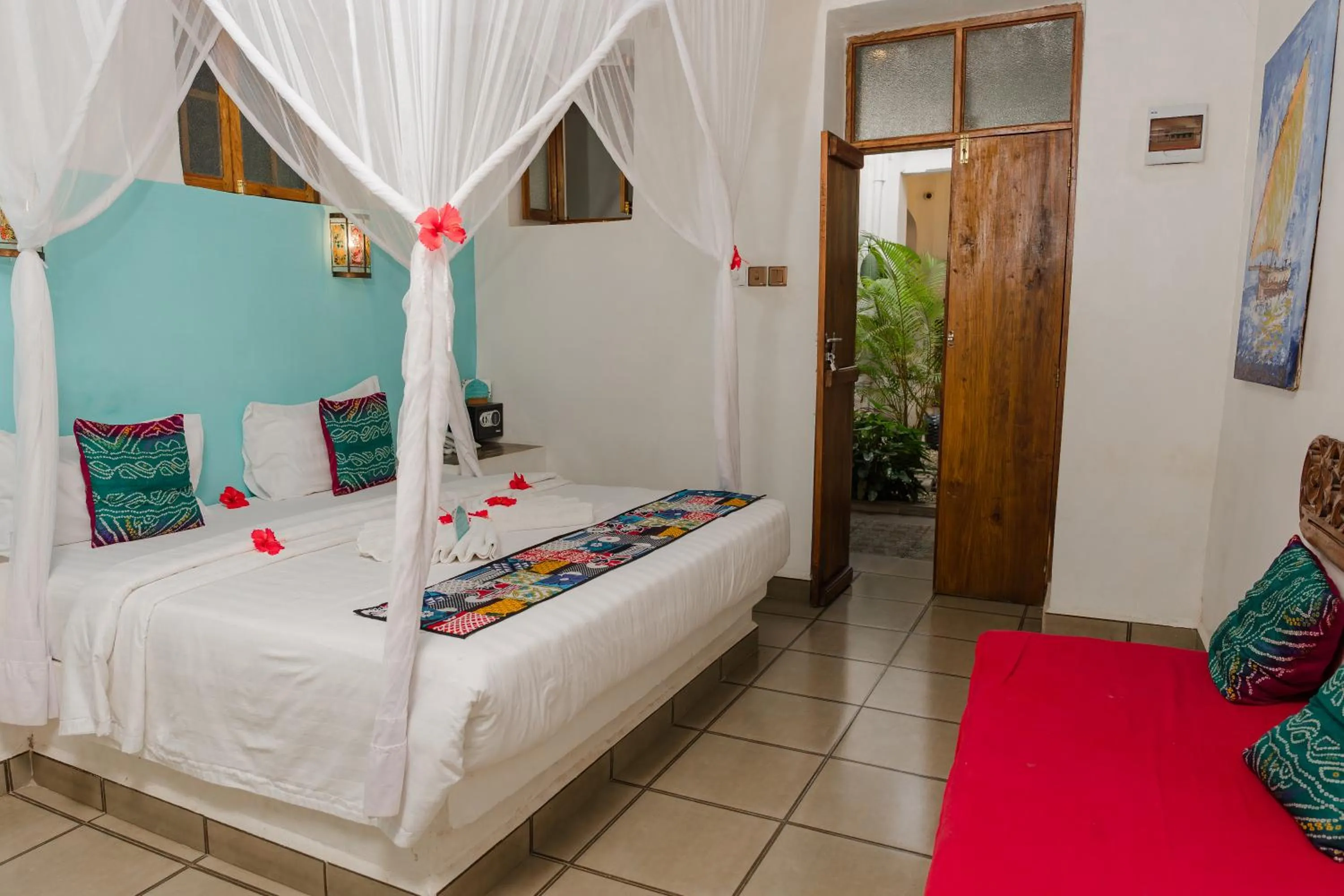 Bed in Emerald Palm Courtyard Hotel