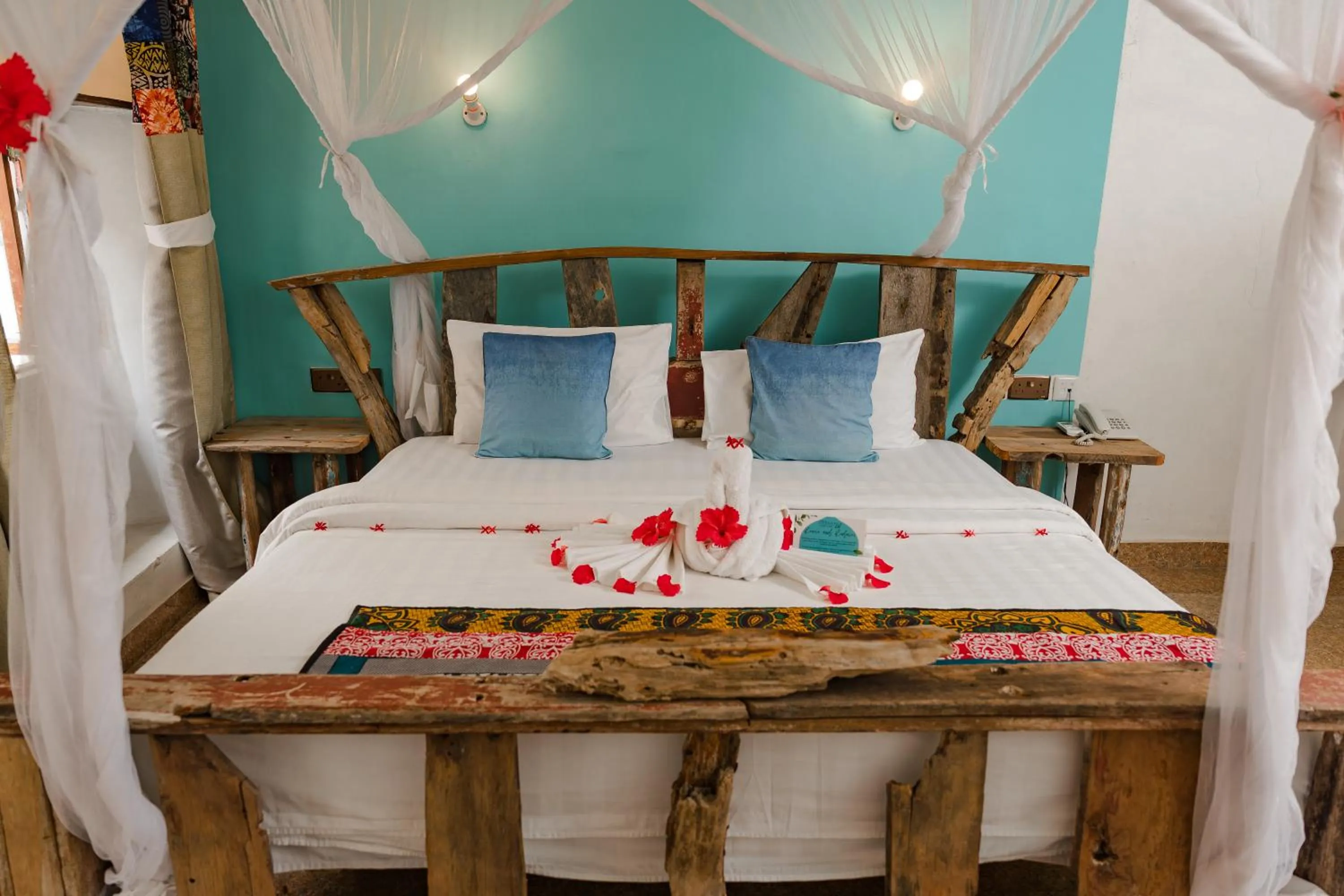 Bed in Emerald Palm Courtyard Hotel