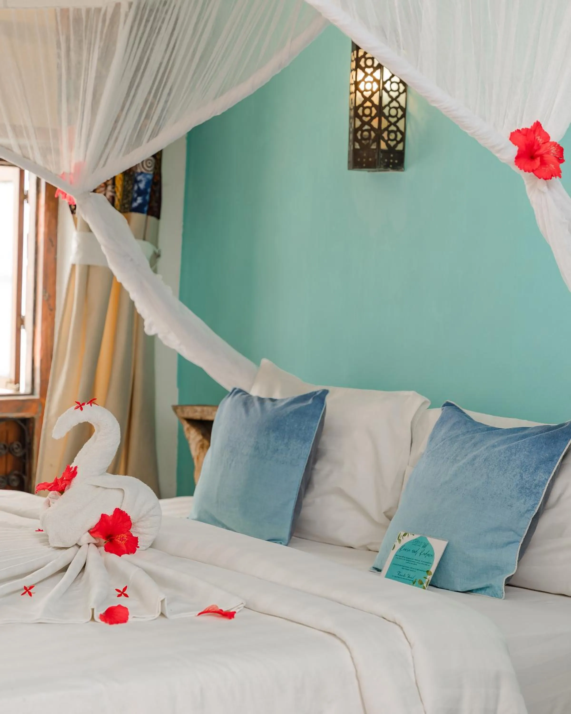 Bed in Emerald Palm Courtyard Hotel