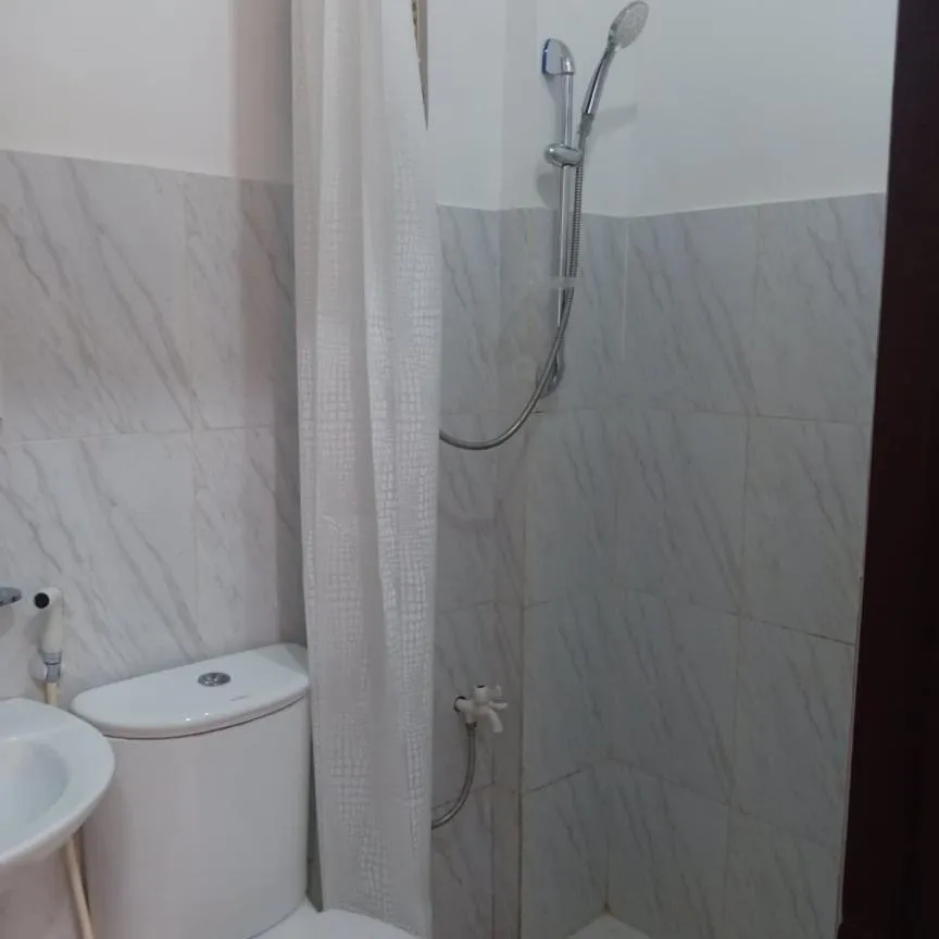 Bathroom in Chelle's Apartelle-Inn