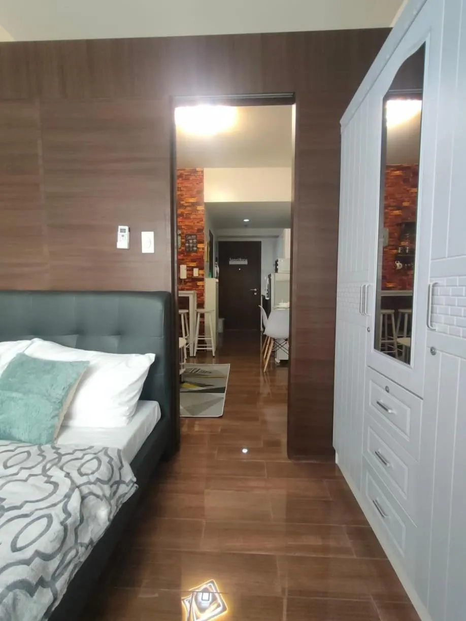 Bed in Fully Furnished 1 Bedroom at SMDC Air Residence with Balcony City View