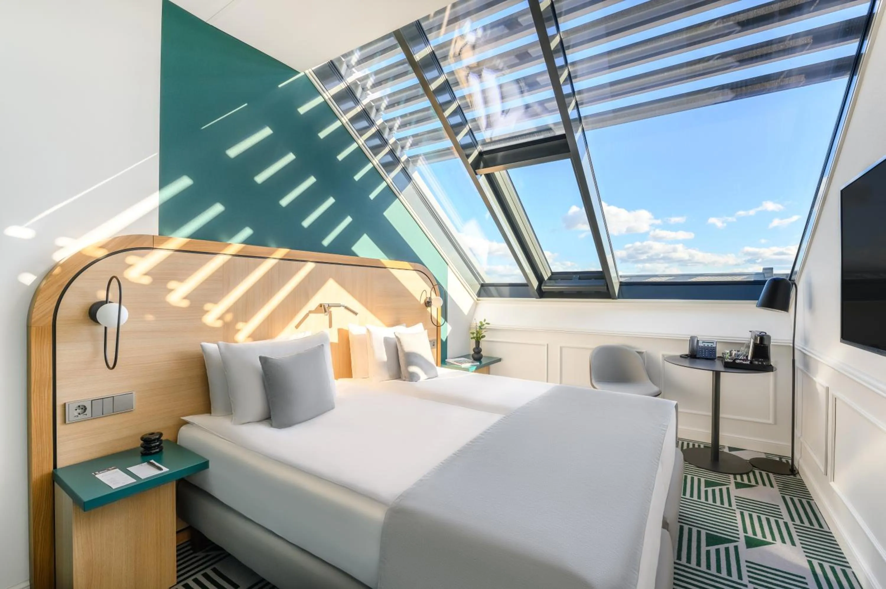 Bed in Hotel Oktogon Haggenmacher by Continental Group