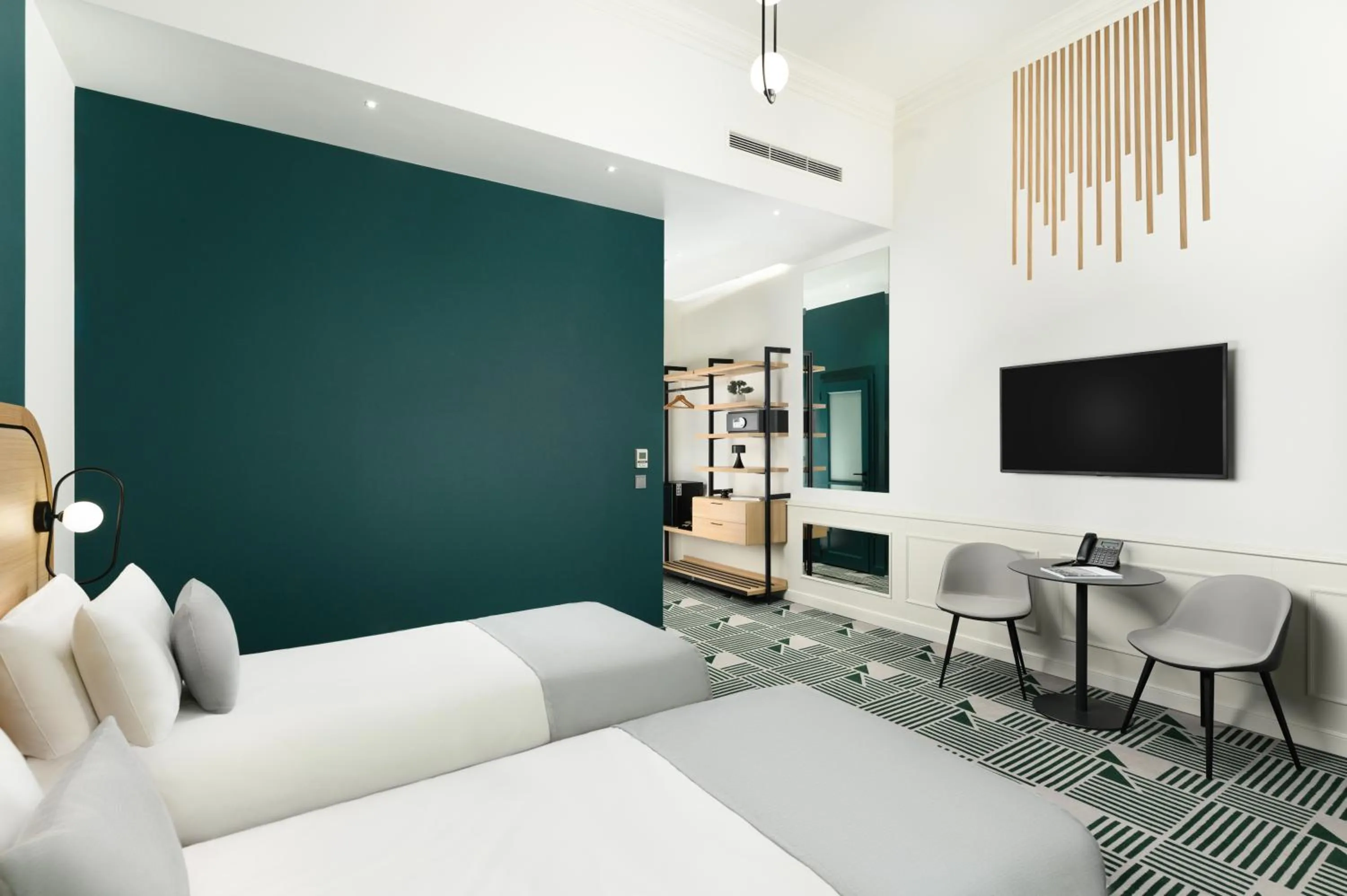 Bed in Hotel Oktogon Haggenmacher by Continental Group