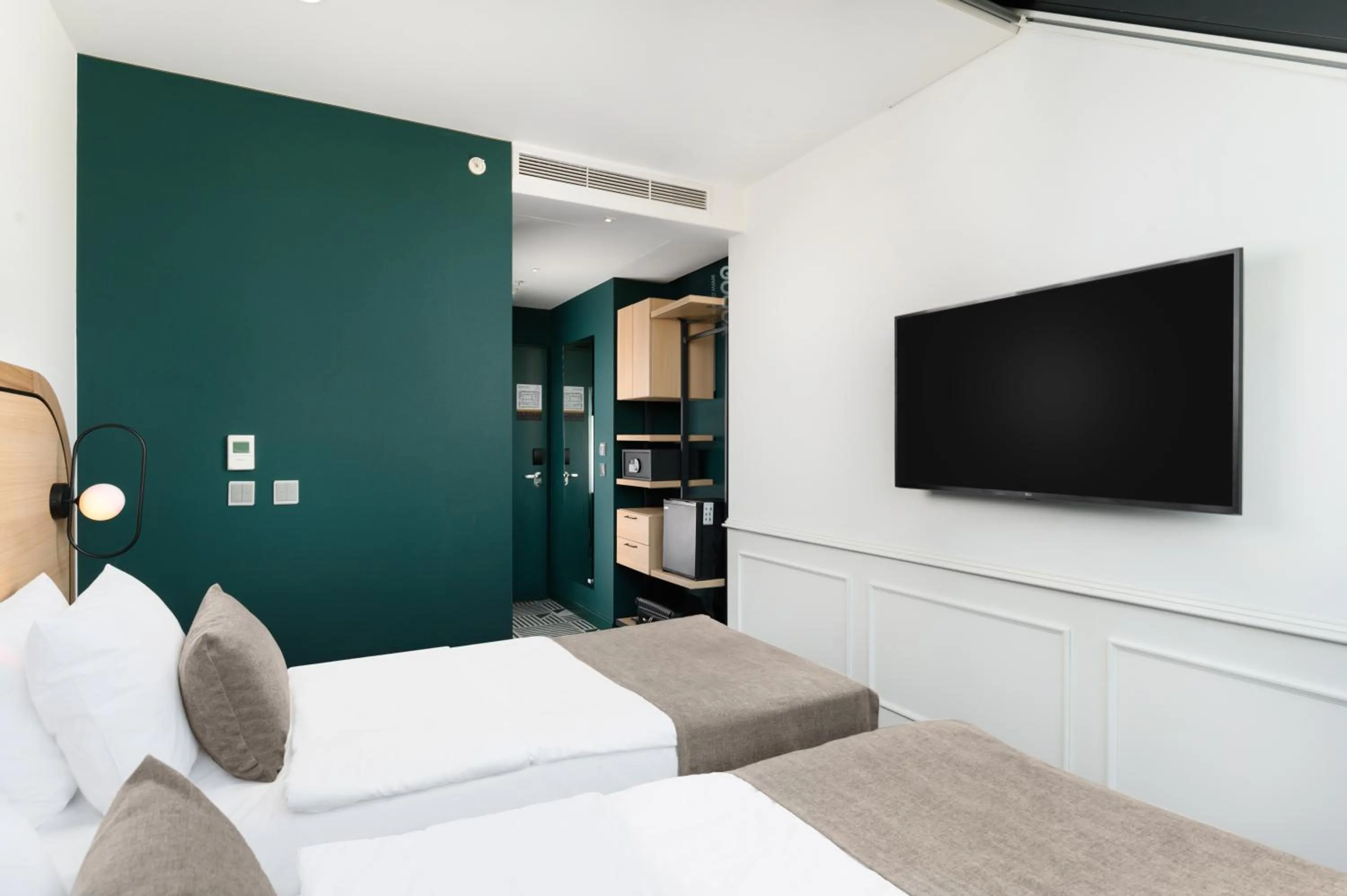 Bed in Hotel Oktogon Haggenmacher by Continental Group