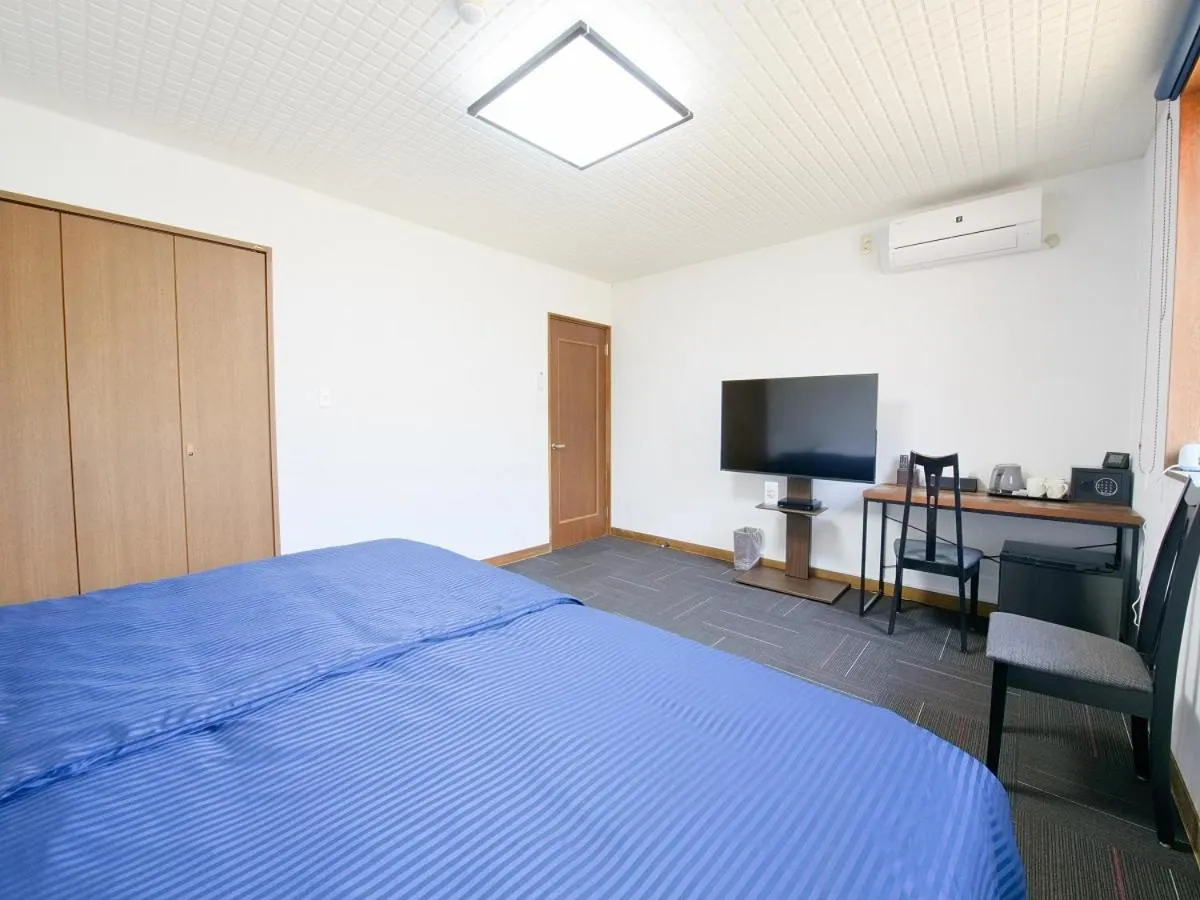 Bed in TABIHAKU STAY 香住