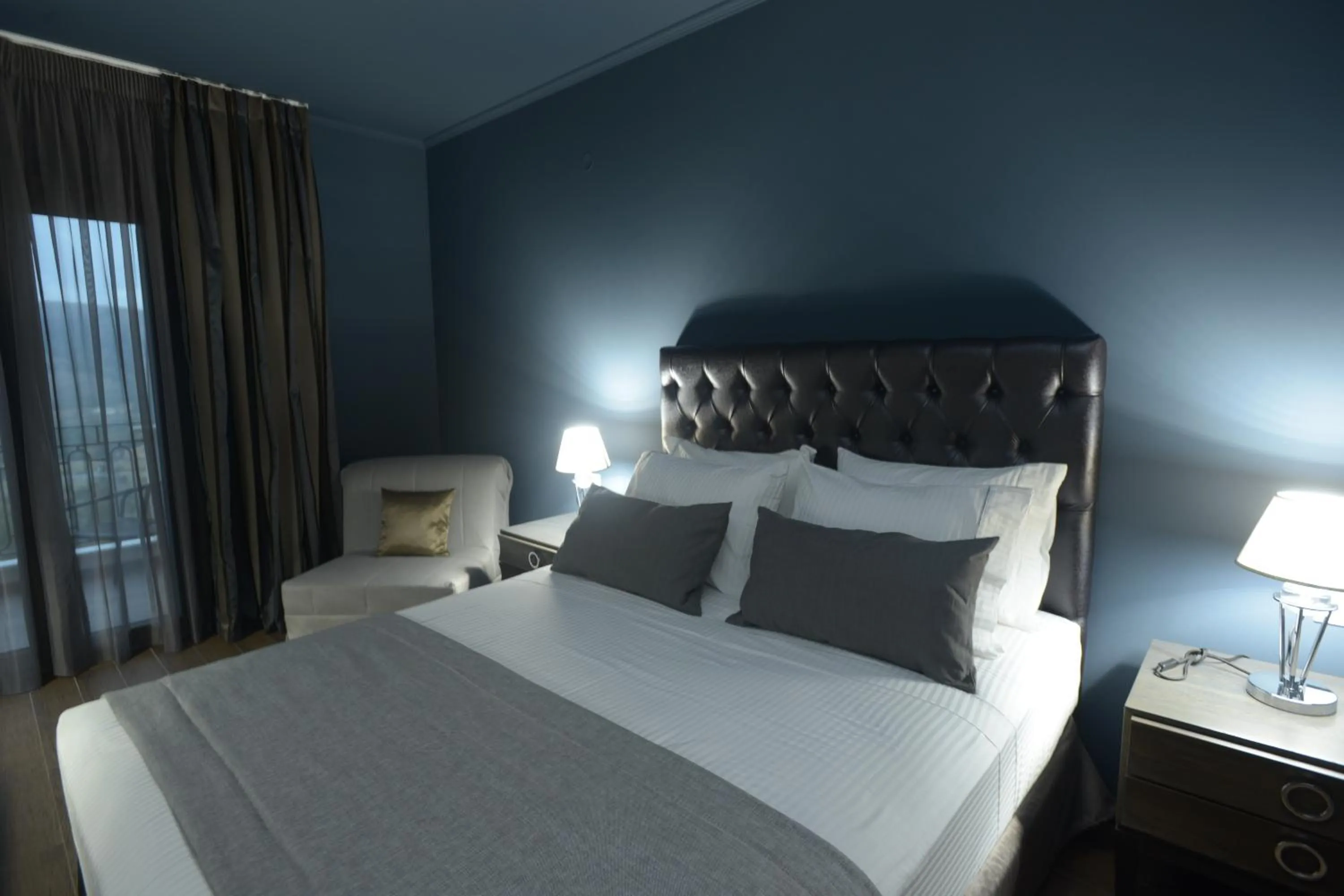 Bed in Theasis Hotel Paramythia