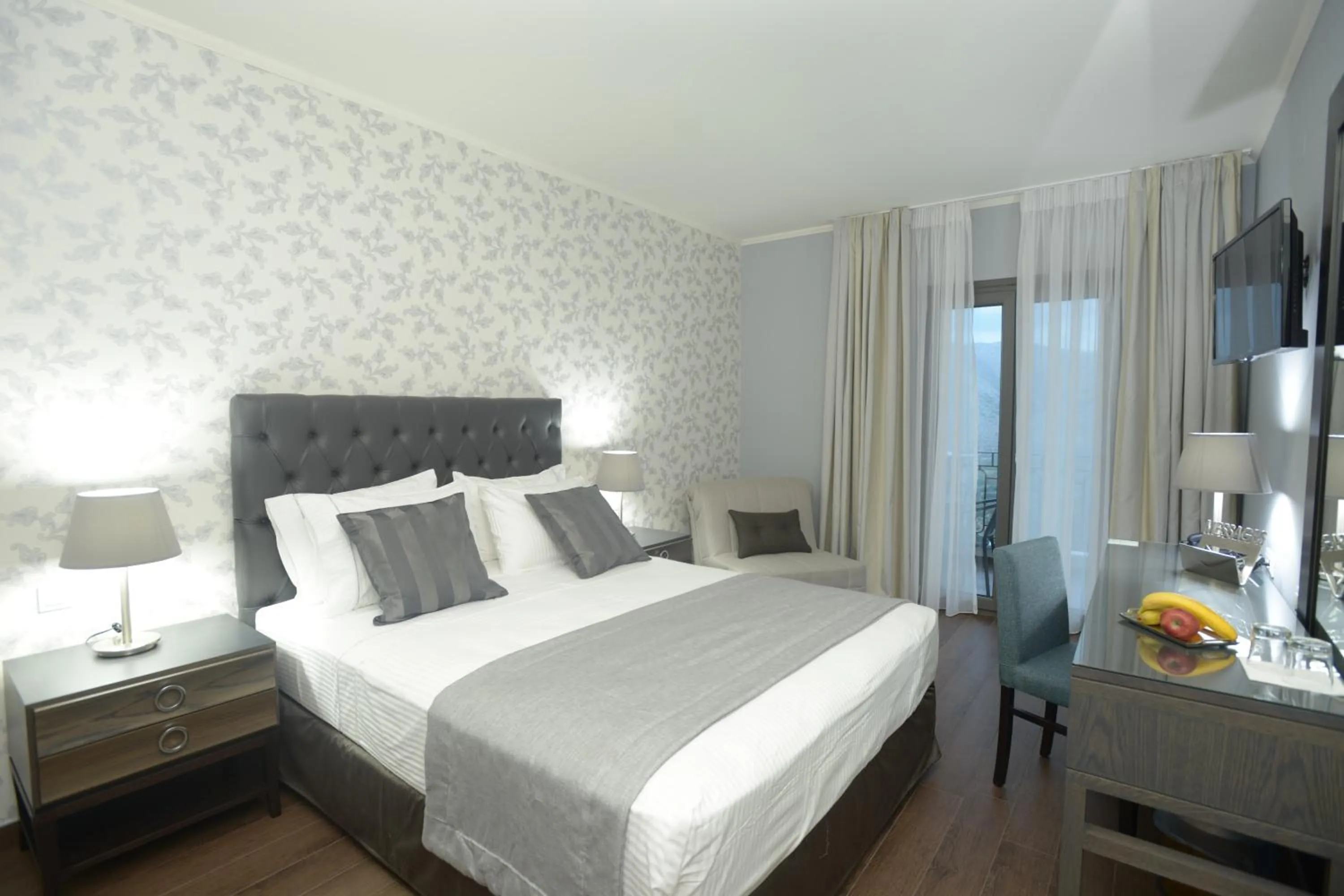 Bed in Theasis Hotel Paramythia