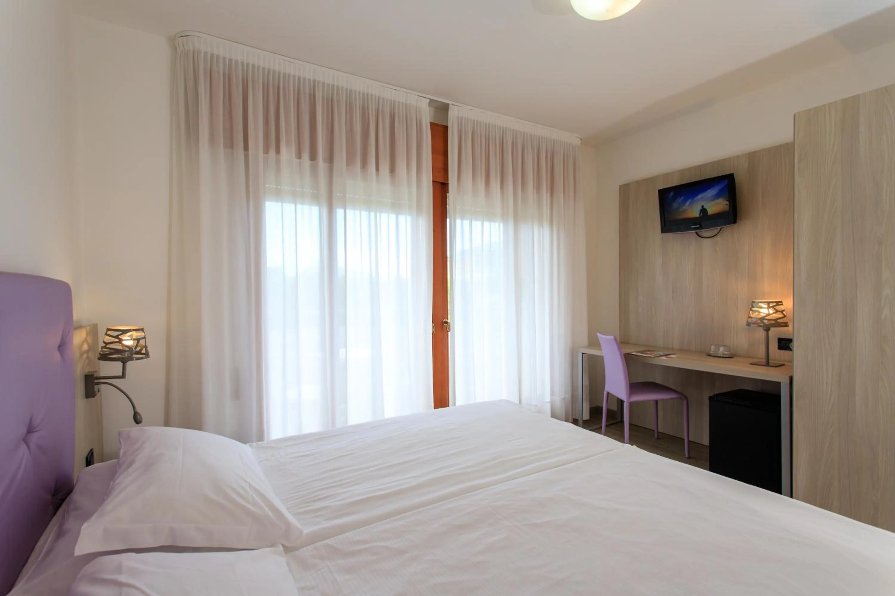 Bed in Fantinello Hotel