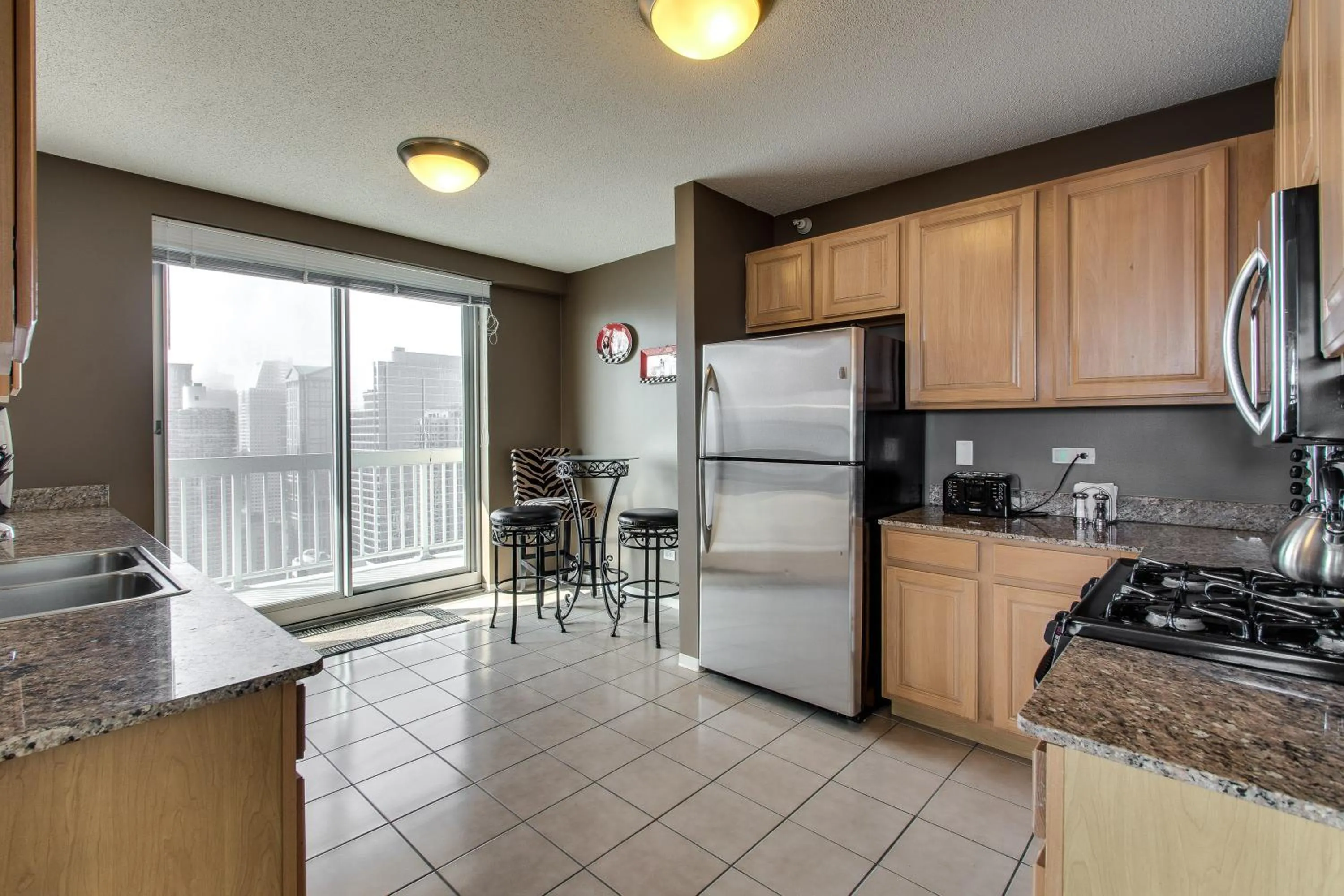 Kitchen or kitchenette in The Penthouse at Grand Plaza