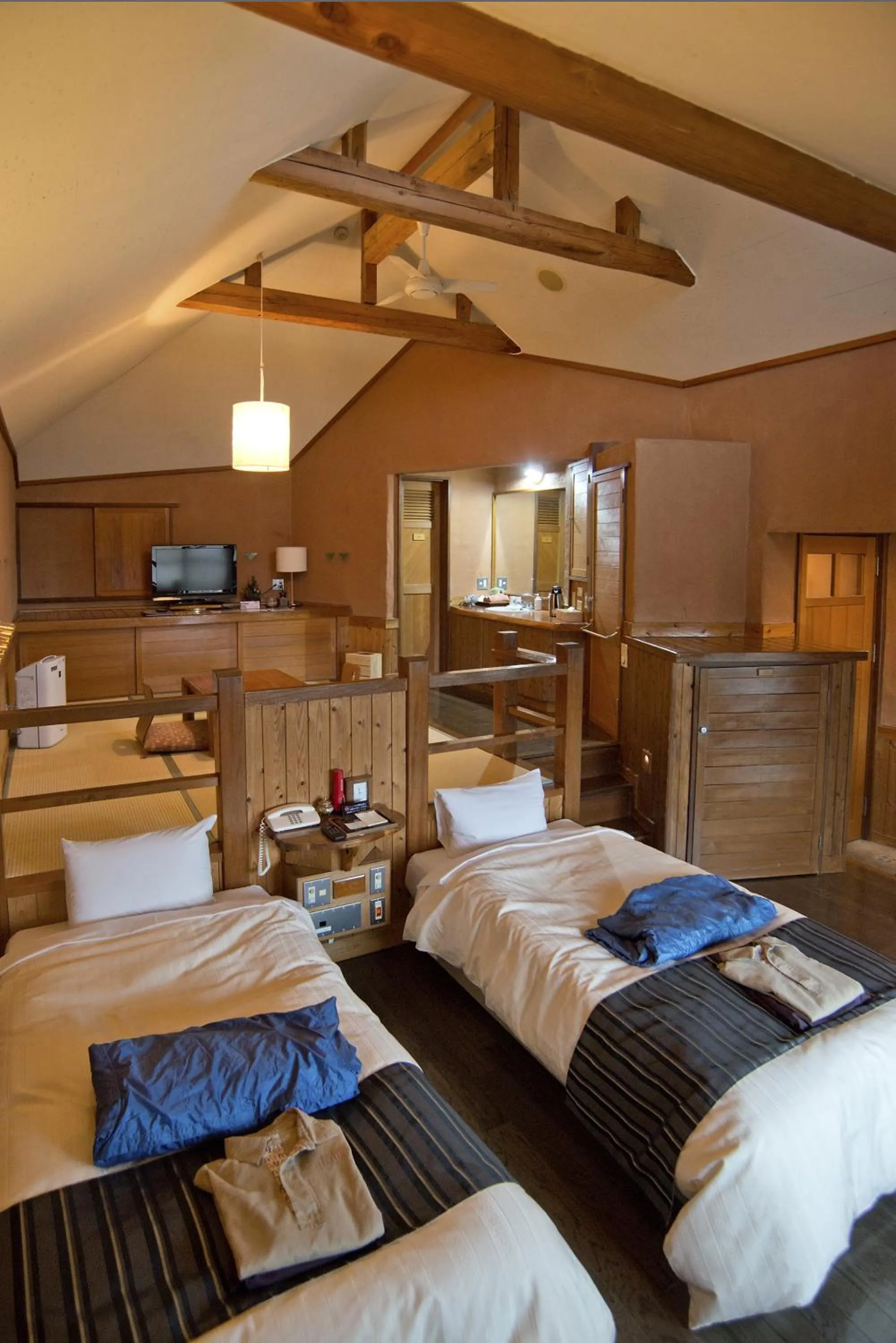 Photo of the whole room, Bed in Resonate Club Kuju