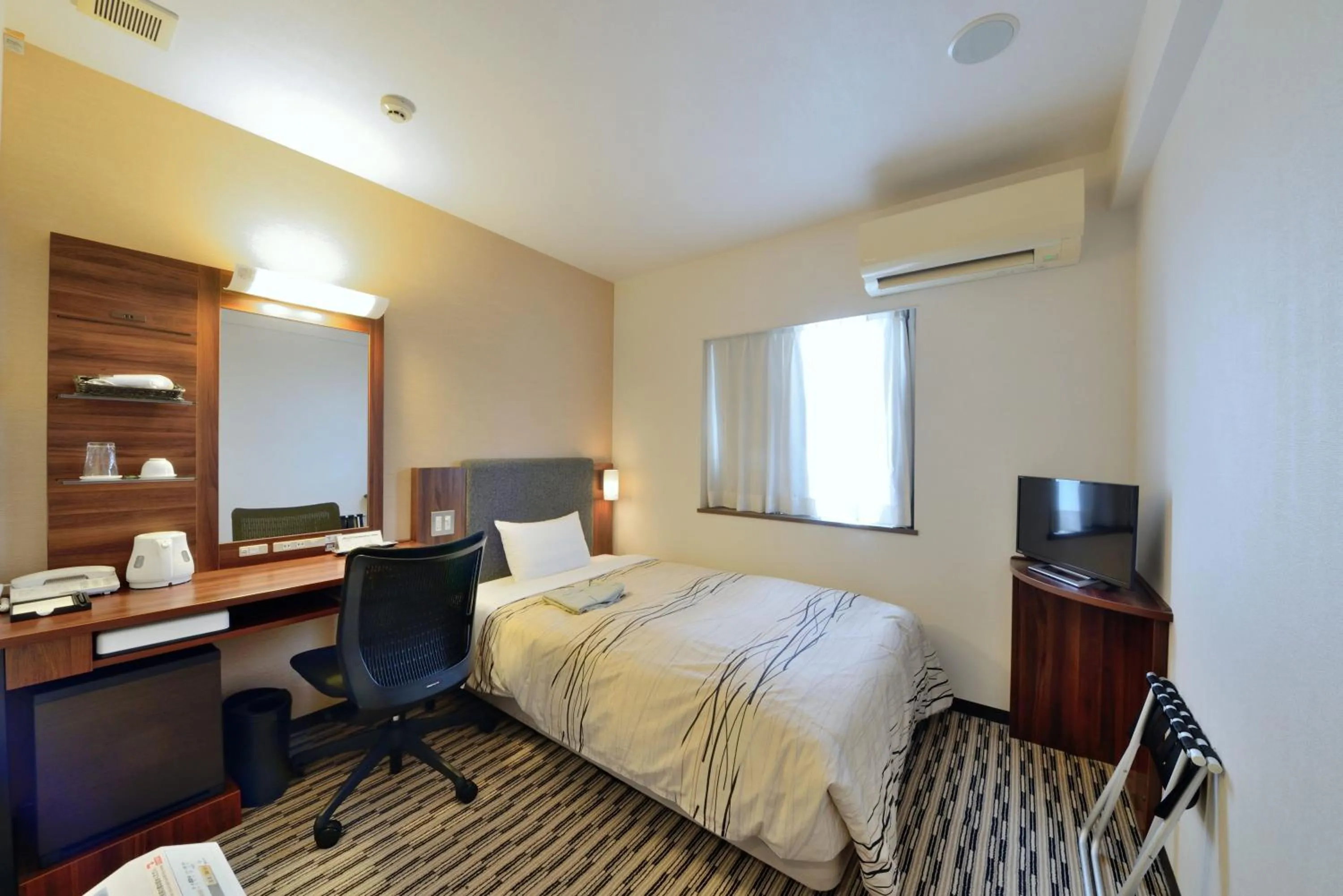 Photo of the whole room, Bed in Uozu Manten Hotel Ekimae