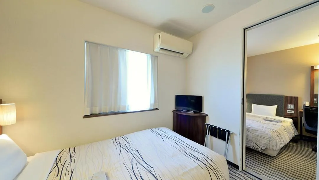 Bed in Uozu Manten Hotel Ekimae