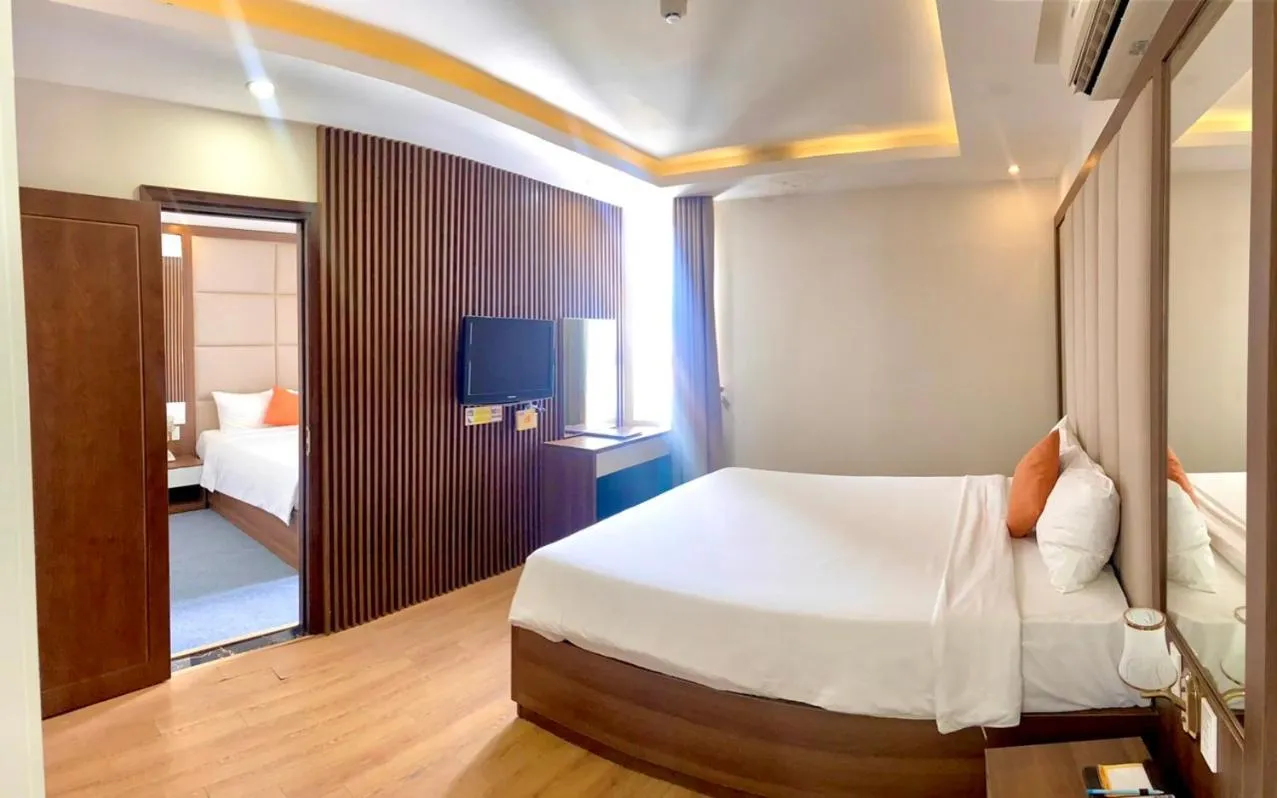 Bed in Pariat River Front Hotel