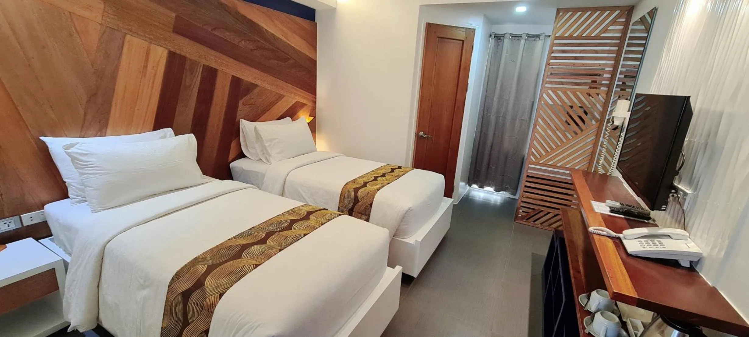 Bed in The Paragon Boracay Suites