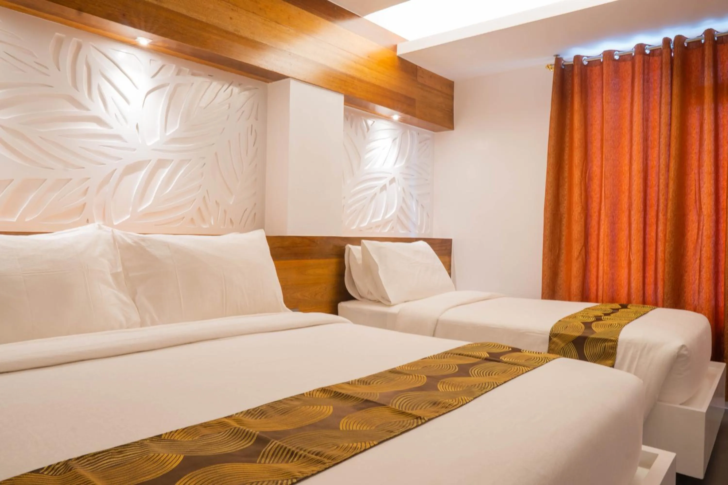 Bed in The Paragon Boracay Suites