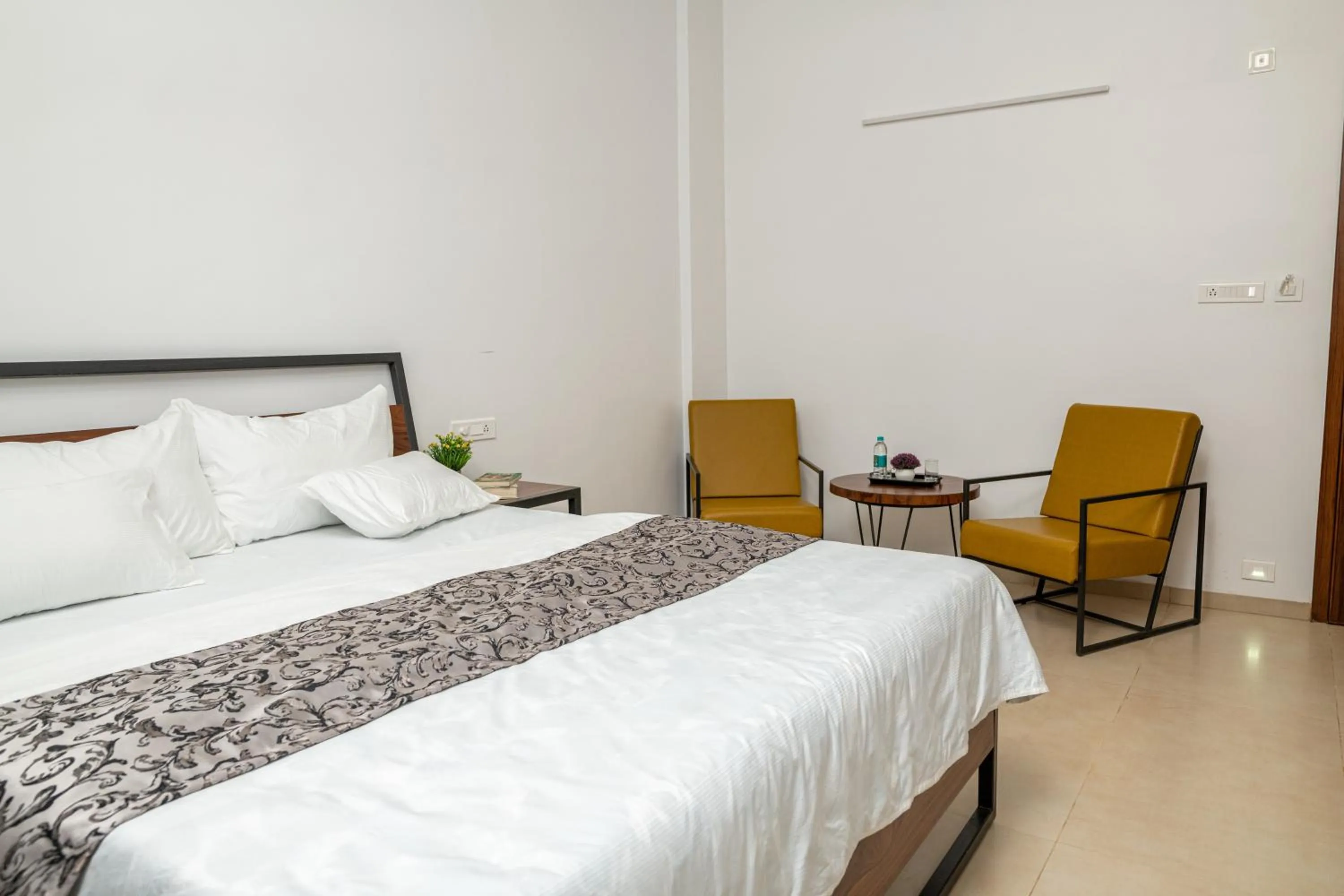 Seating area, Bed in The Green Estate Resort