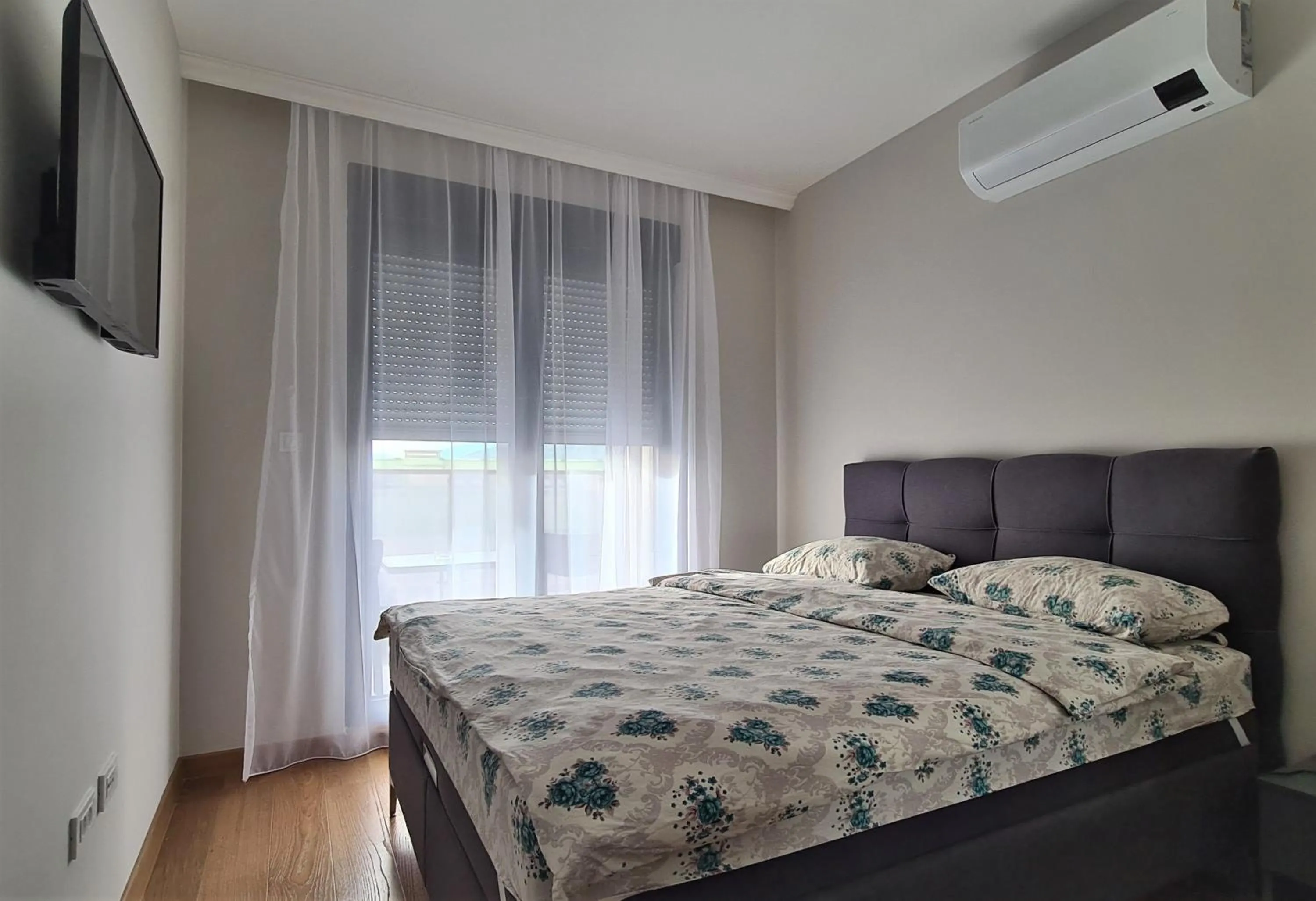 Bed in Green Apartments Podgorica With Garage