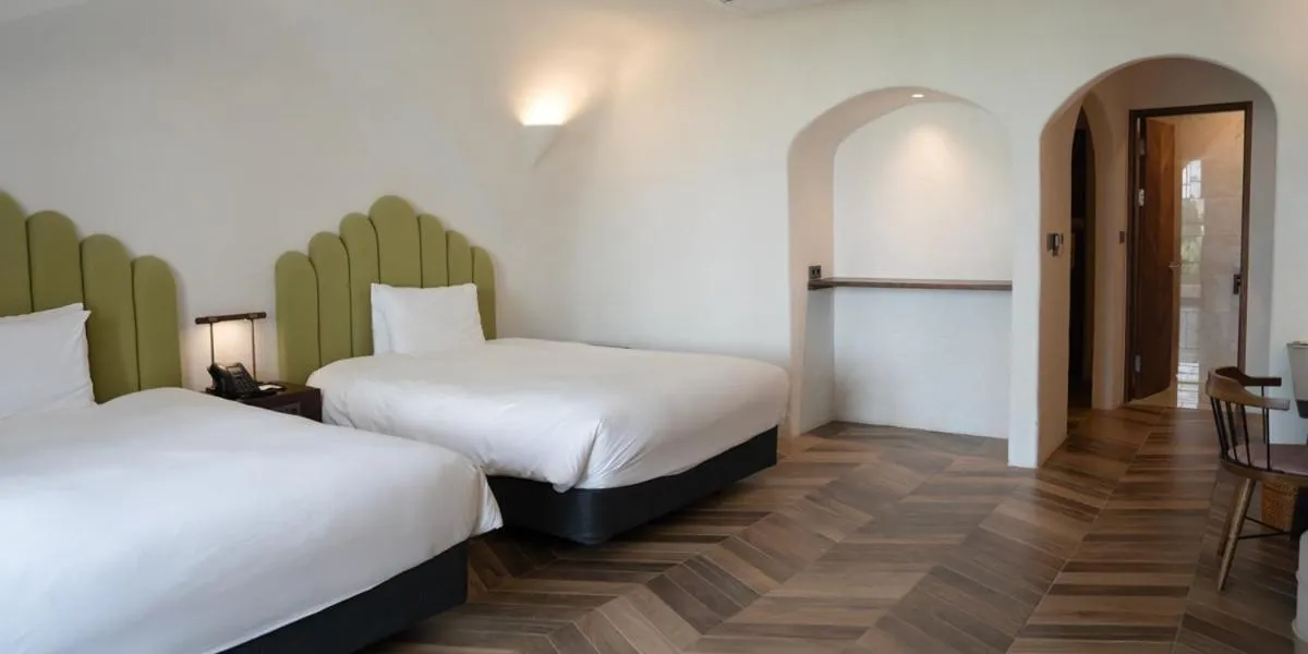 Bed in Ecoland Hotel