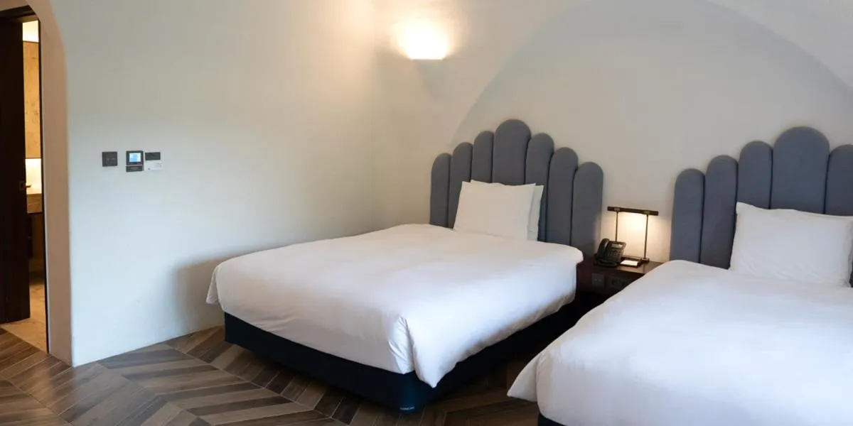 Bed in Ecoland Hotel