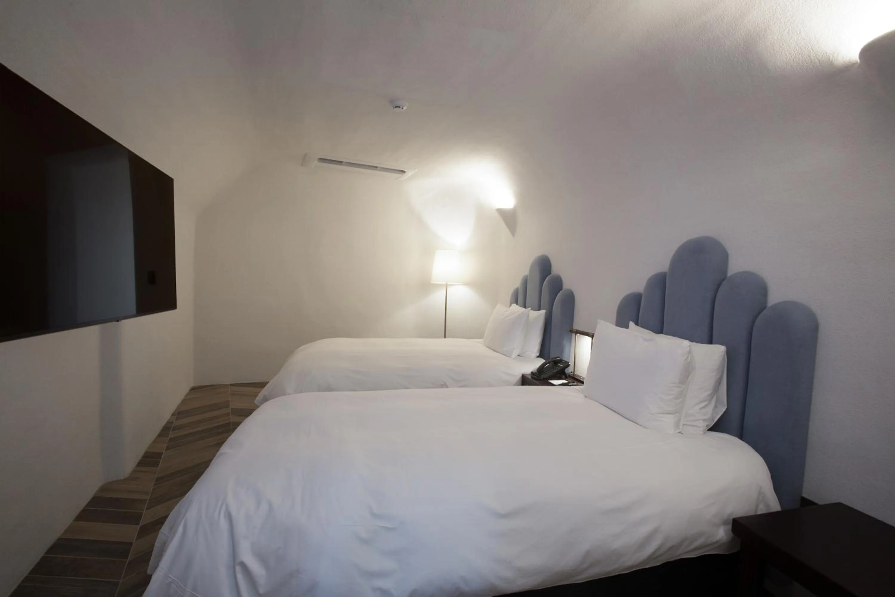 Bed in Ecoland Hotel