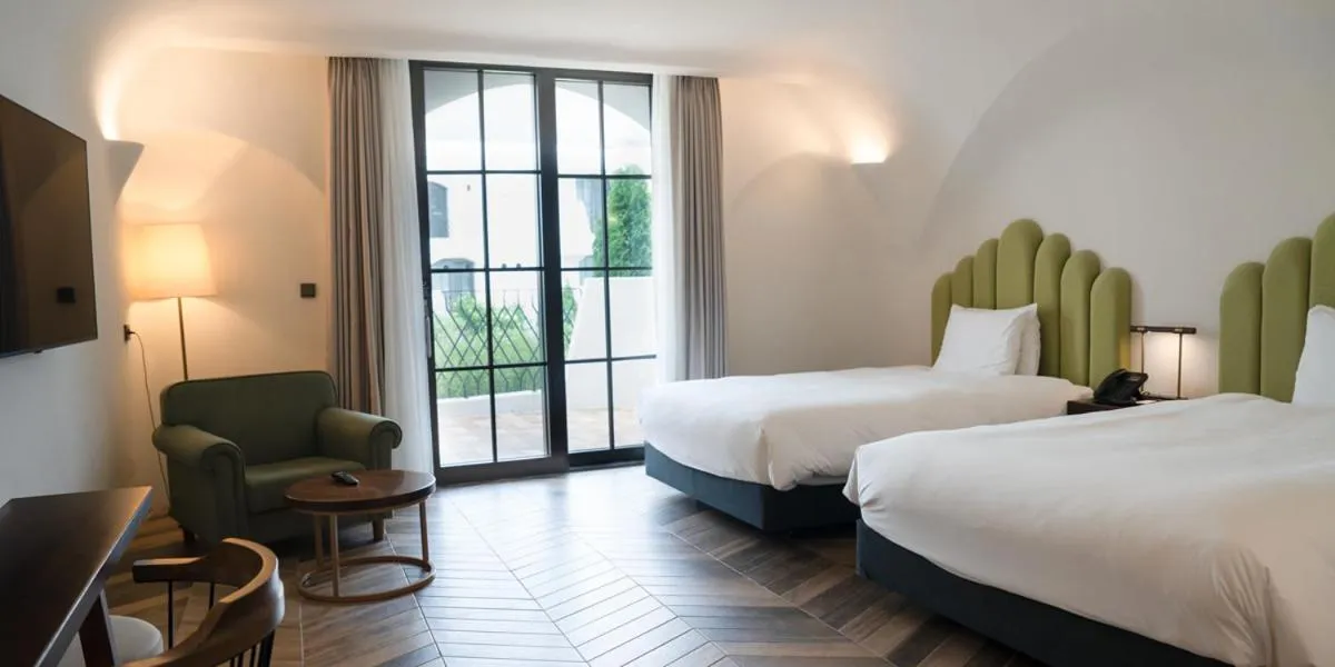 Bed in Ecoland Hotel