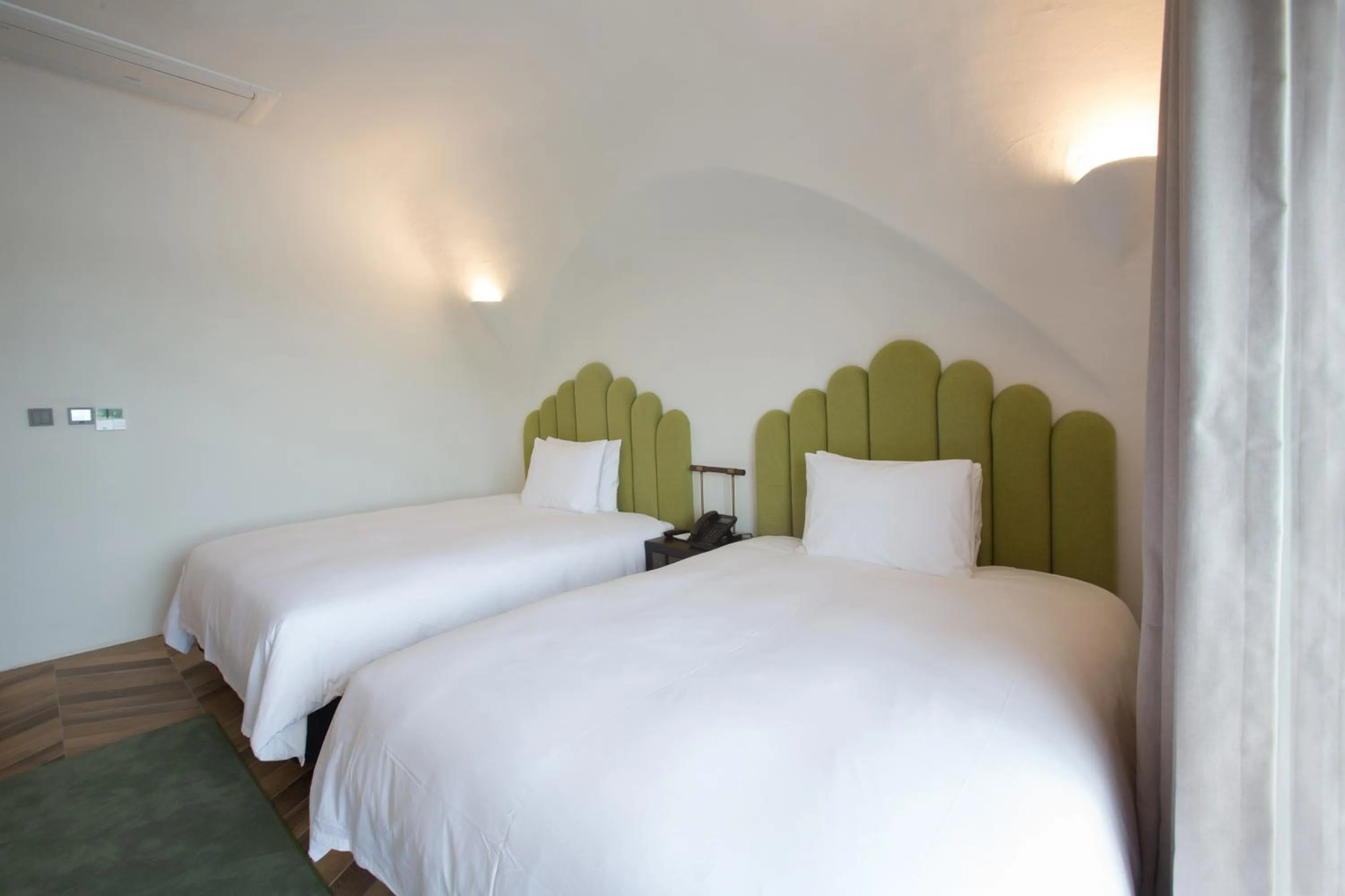 Bed in Ecoland Hotel