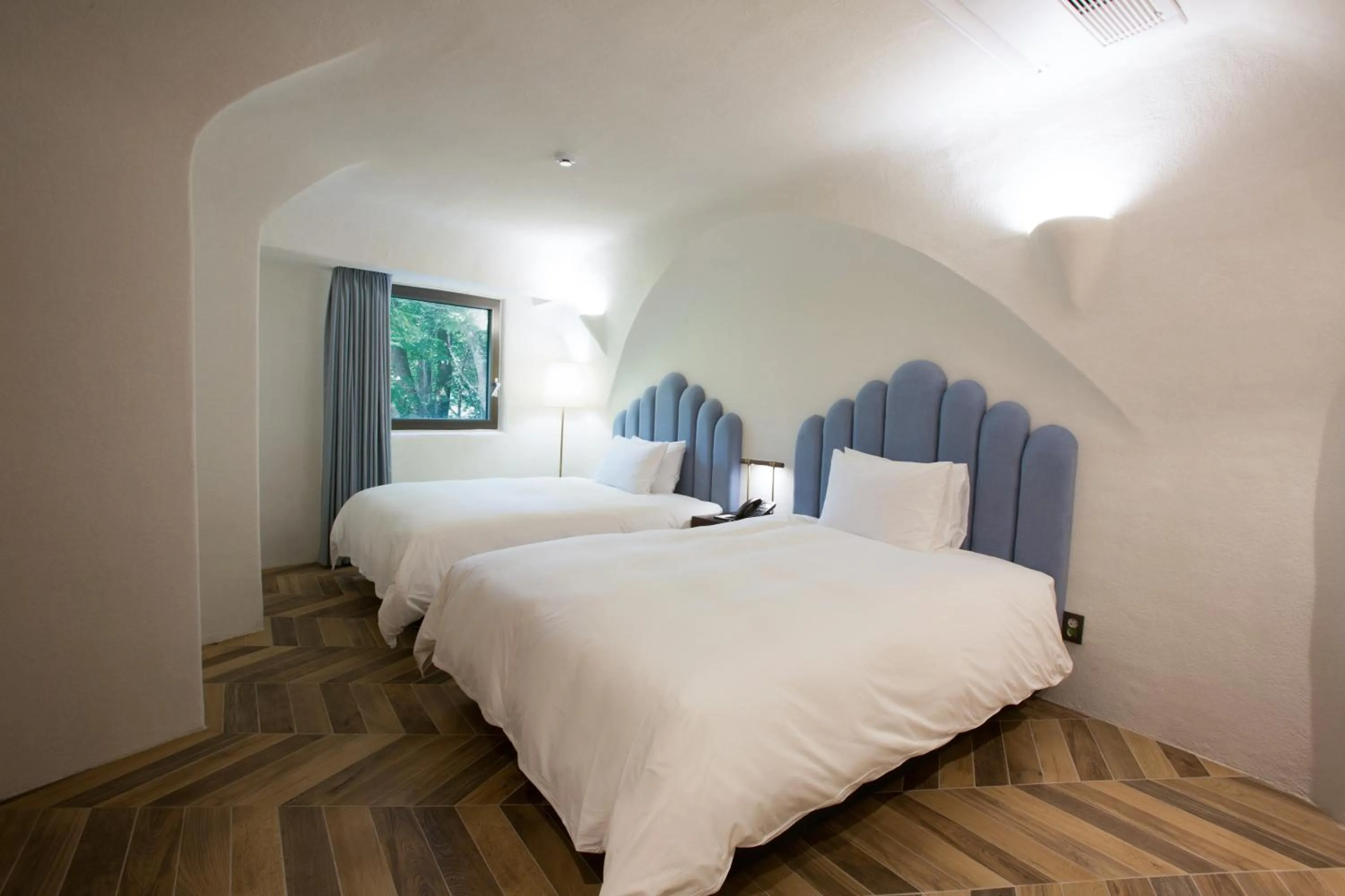 Bed in Ecoland Hotel