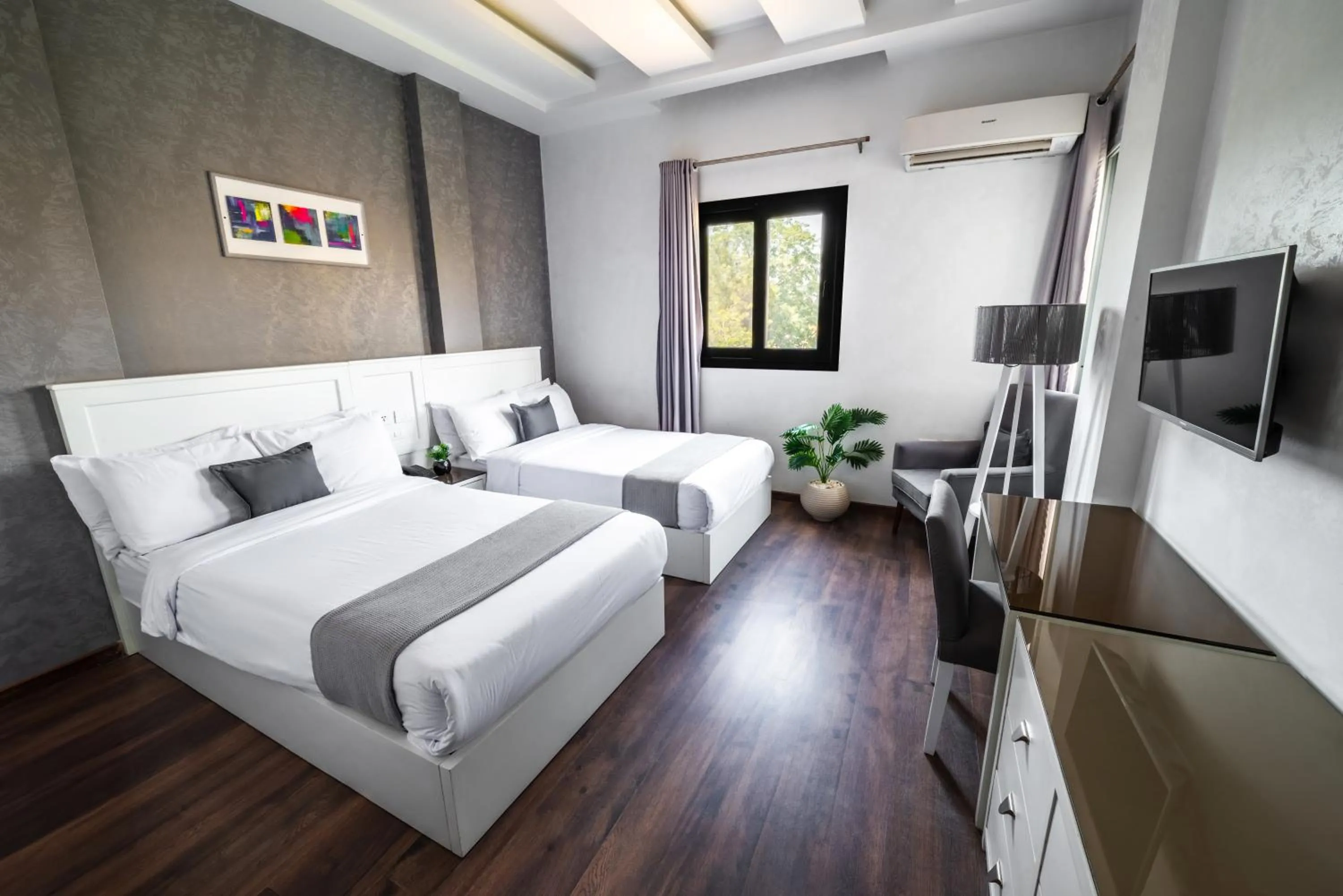 Communal lounge/ TV room, Bed in Nile Villa Hotel