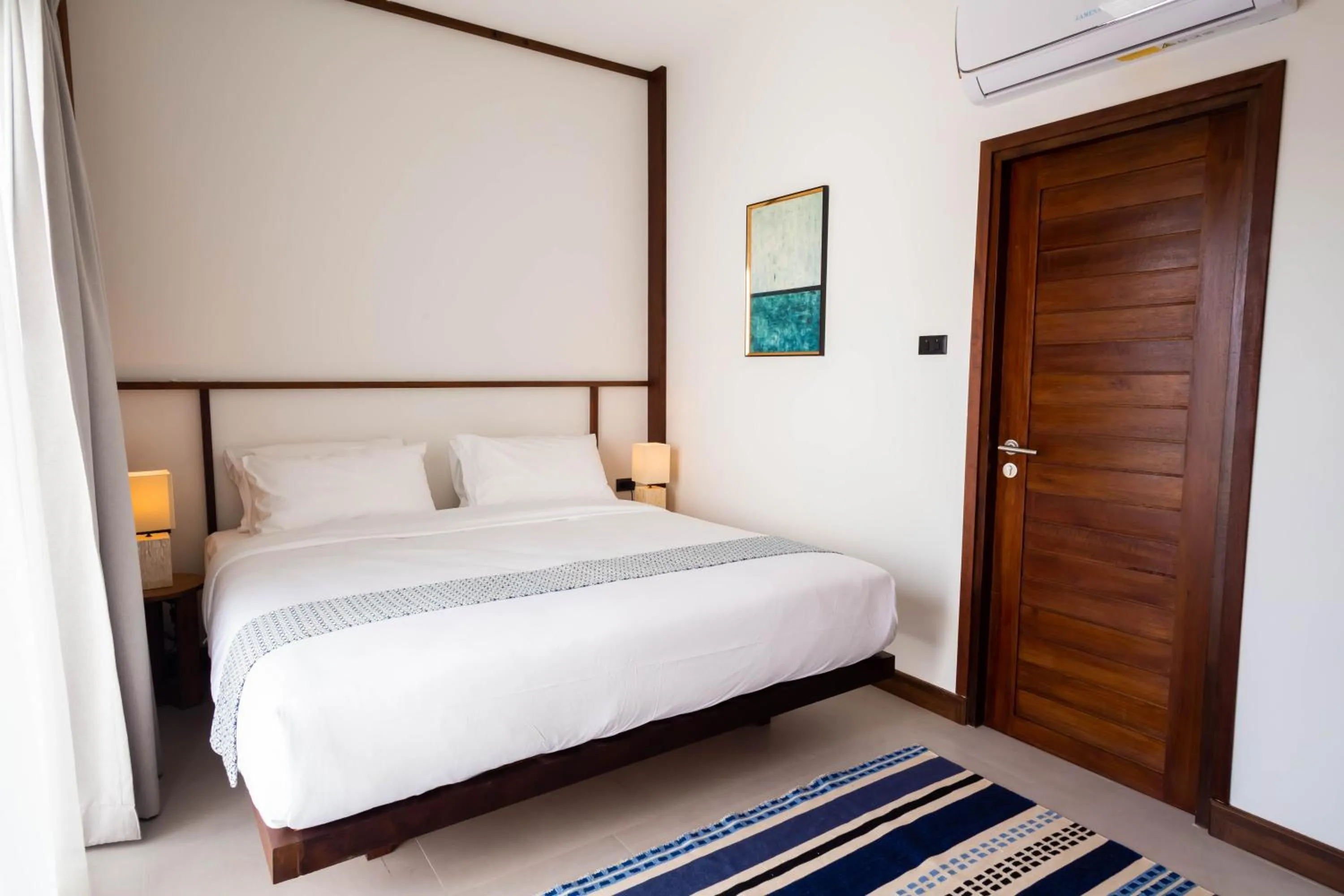 Bed in Baan Kamana Guest House