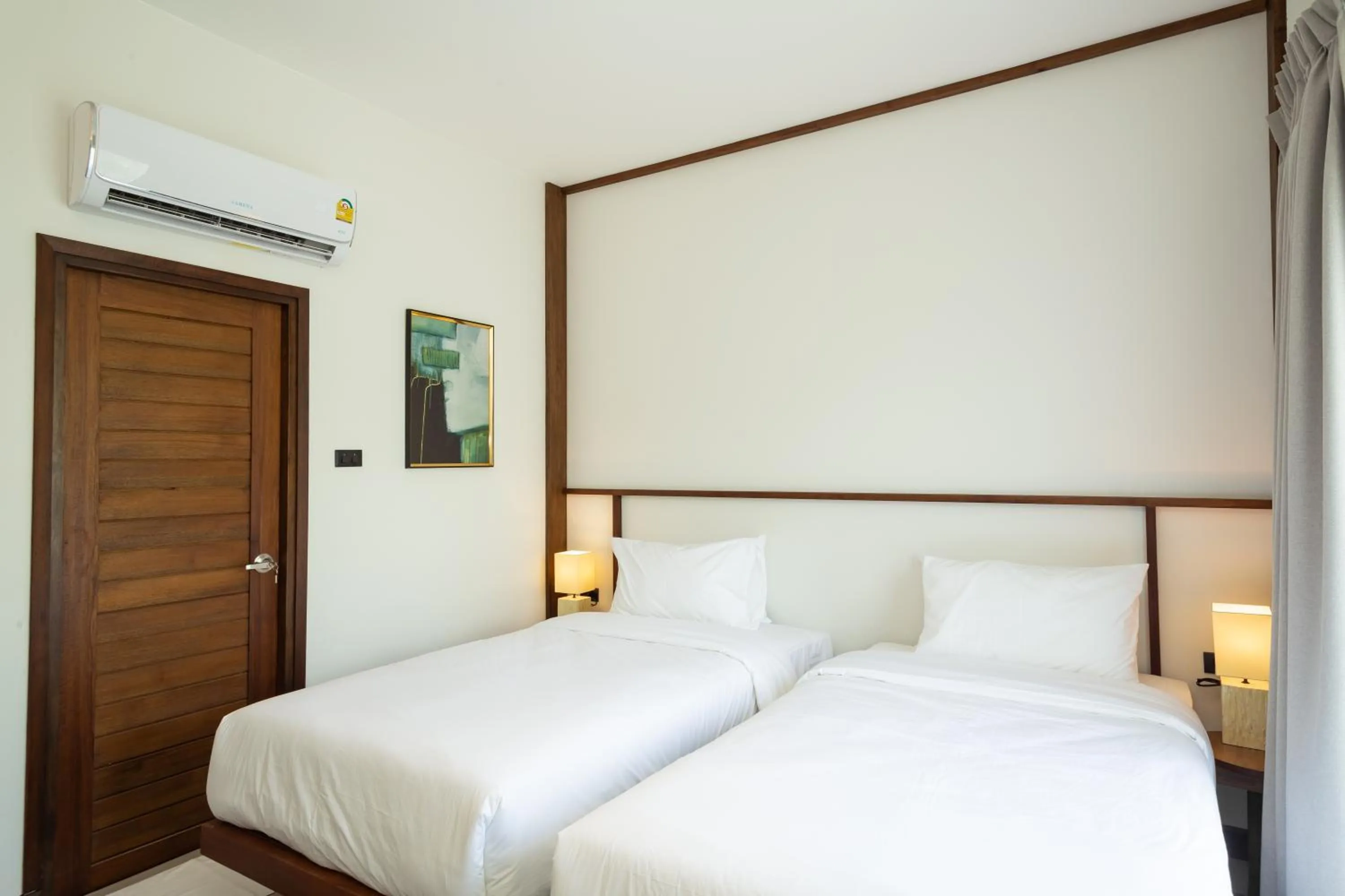 Bed in Baan Kamana Guest House