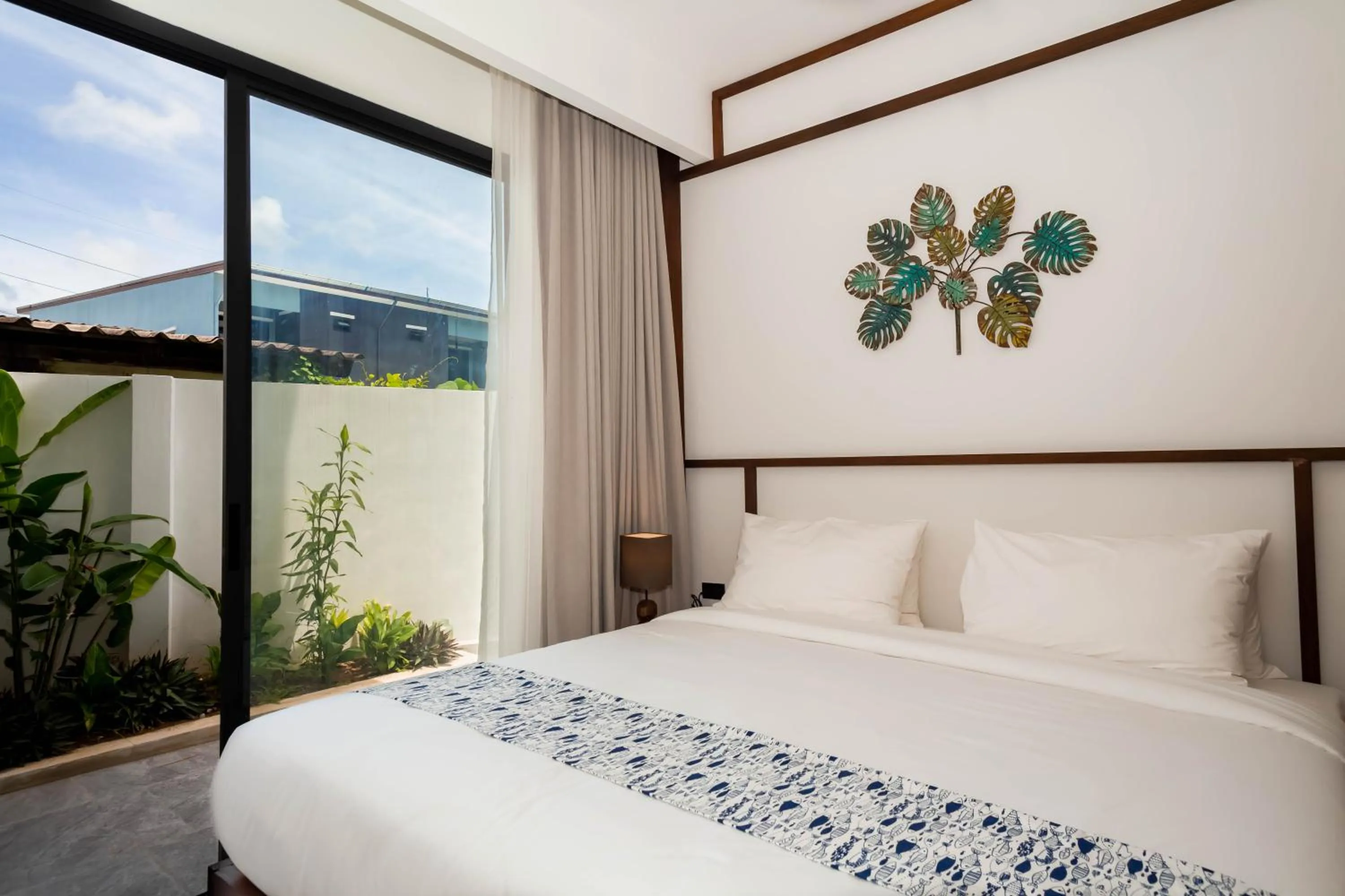 Bed in Baan Kamana Guest House