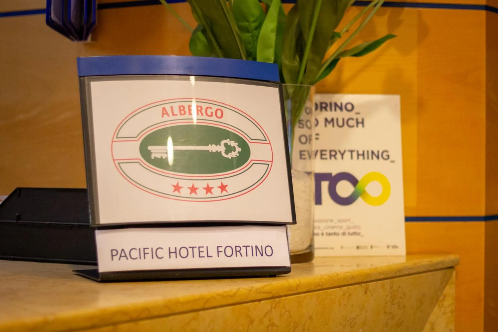 Property logo or sign in Pacific Hotel Fortino