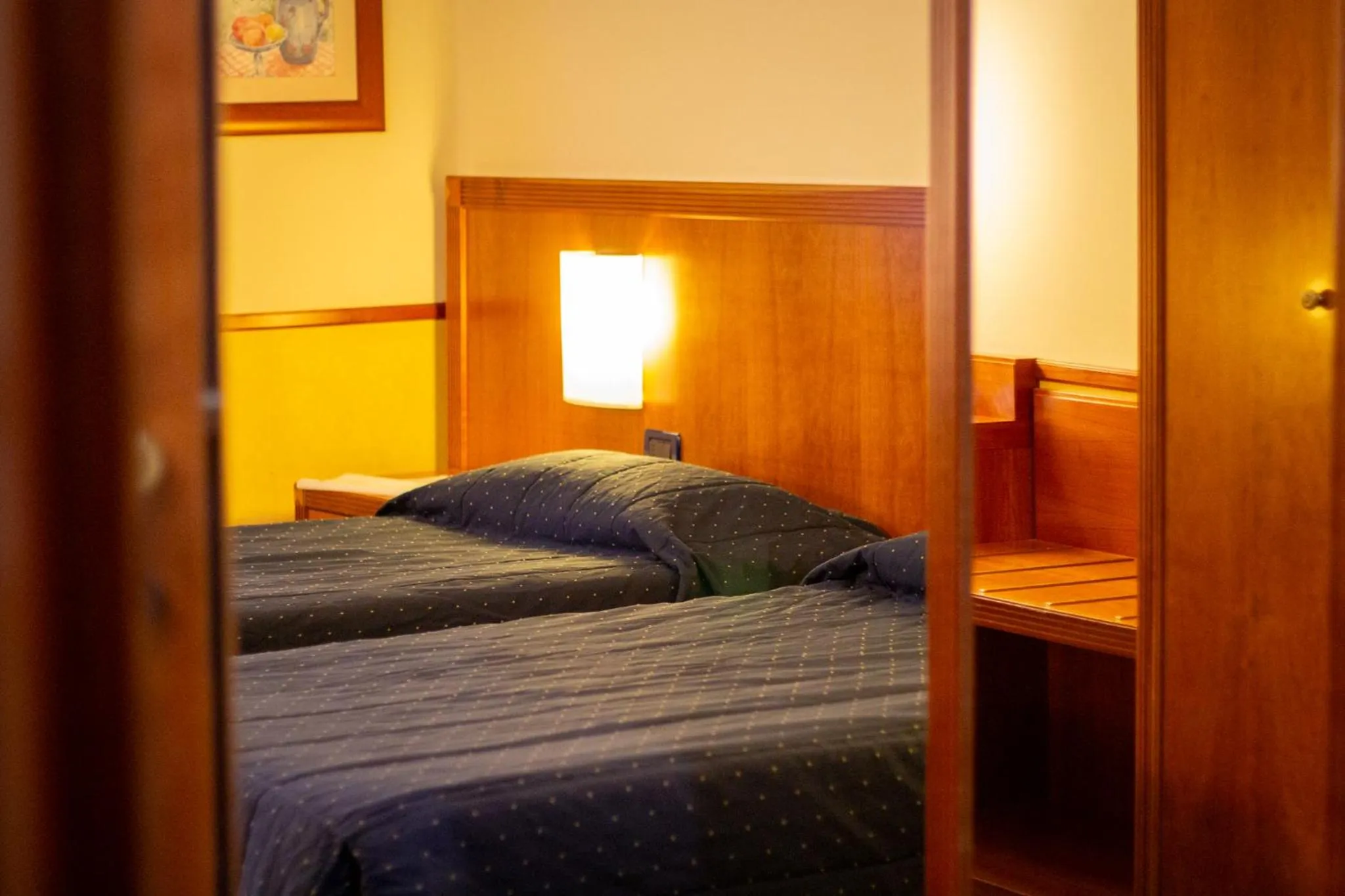 Bed in Pacific Hotel Fortino