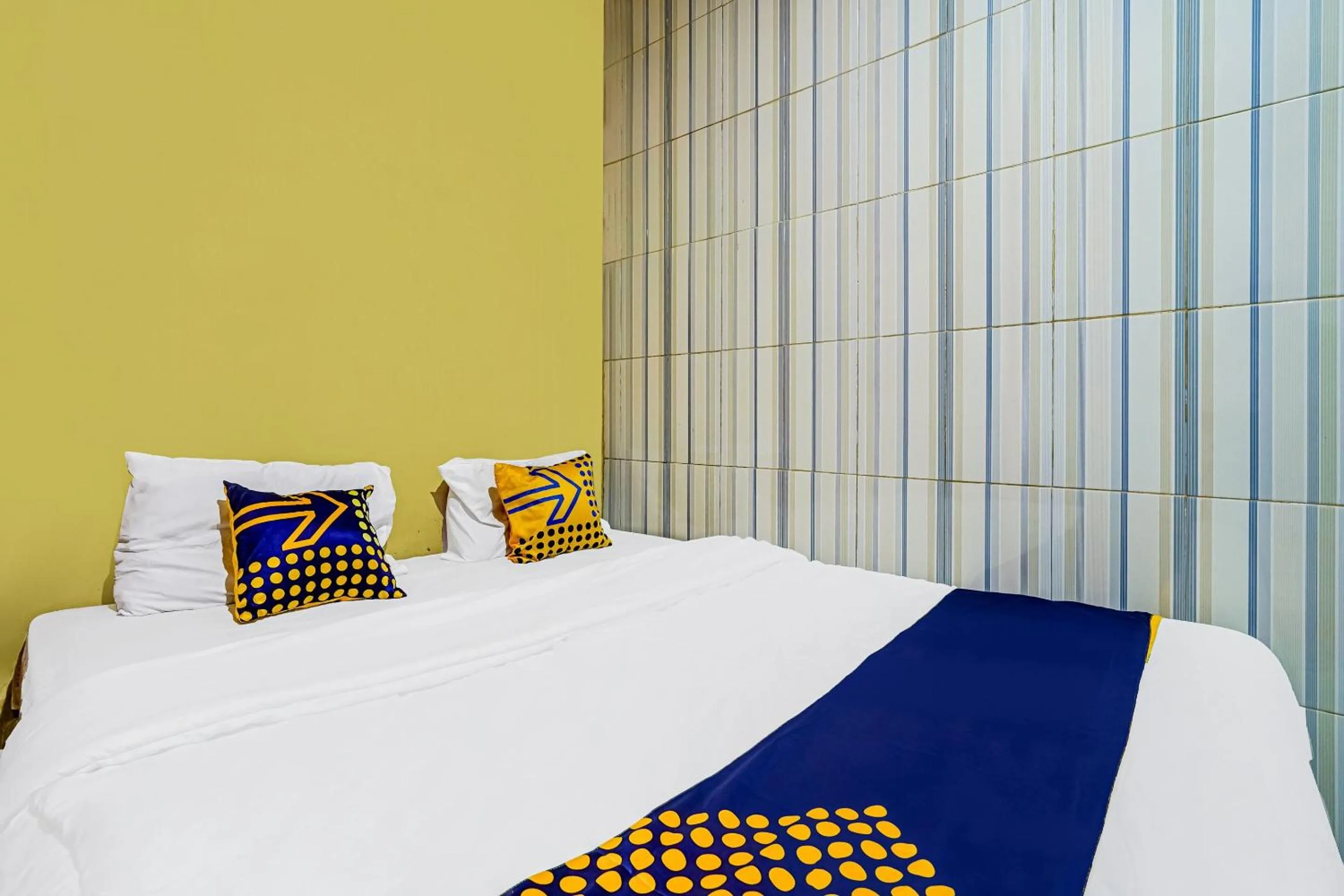 Bedroom in SPOT ON 91186 Losmen Yanti