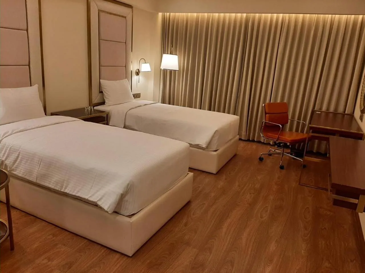Bed in KAY-EM Spectra Hotel