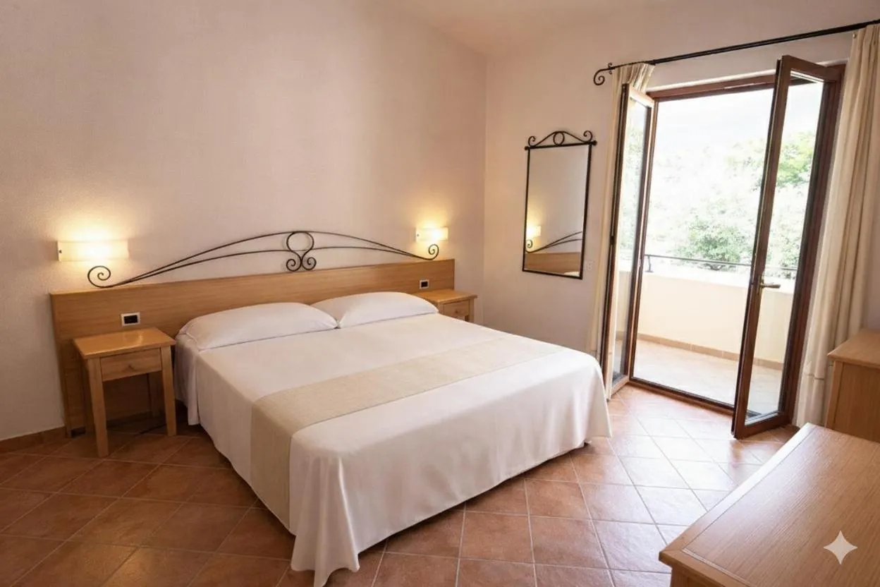 Bed in Hotel Villa Gustui Maris