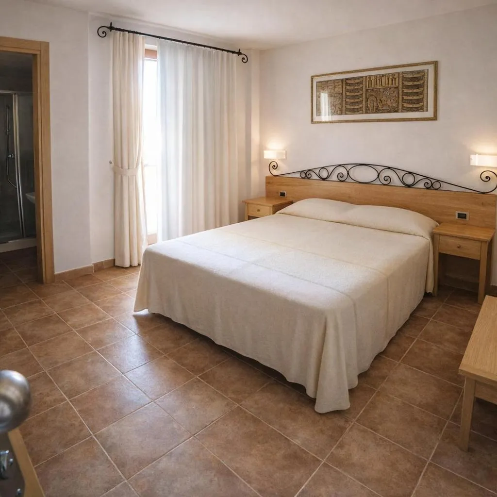 Bed in Hotel Villa Gustui Maris