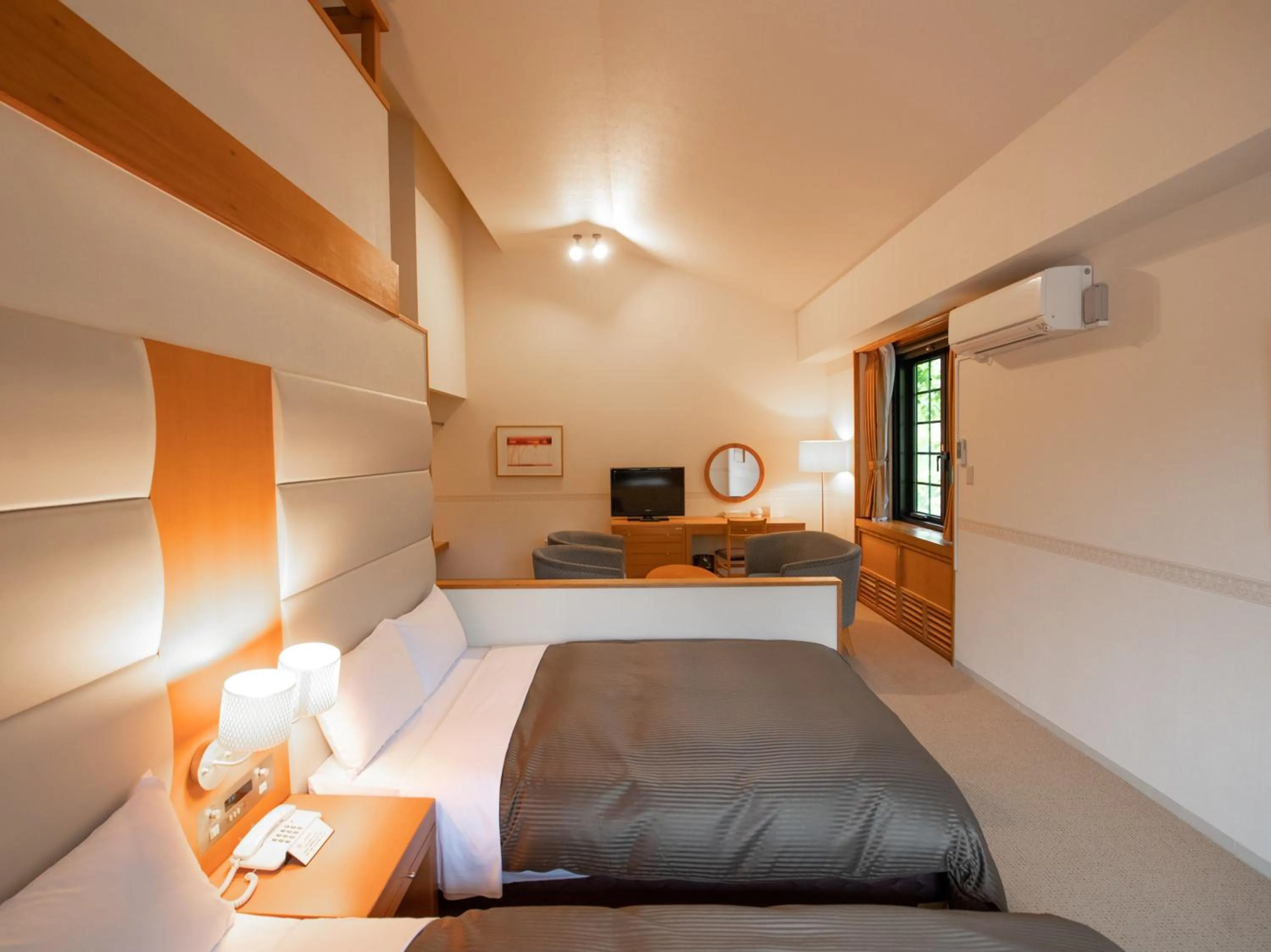 Bed in Tabist Hotel Colosseum Inn Tateshina