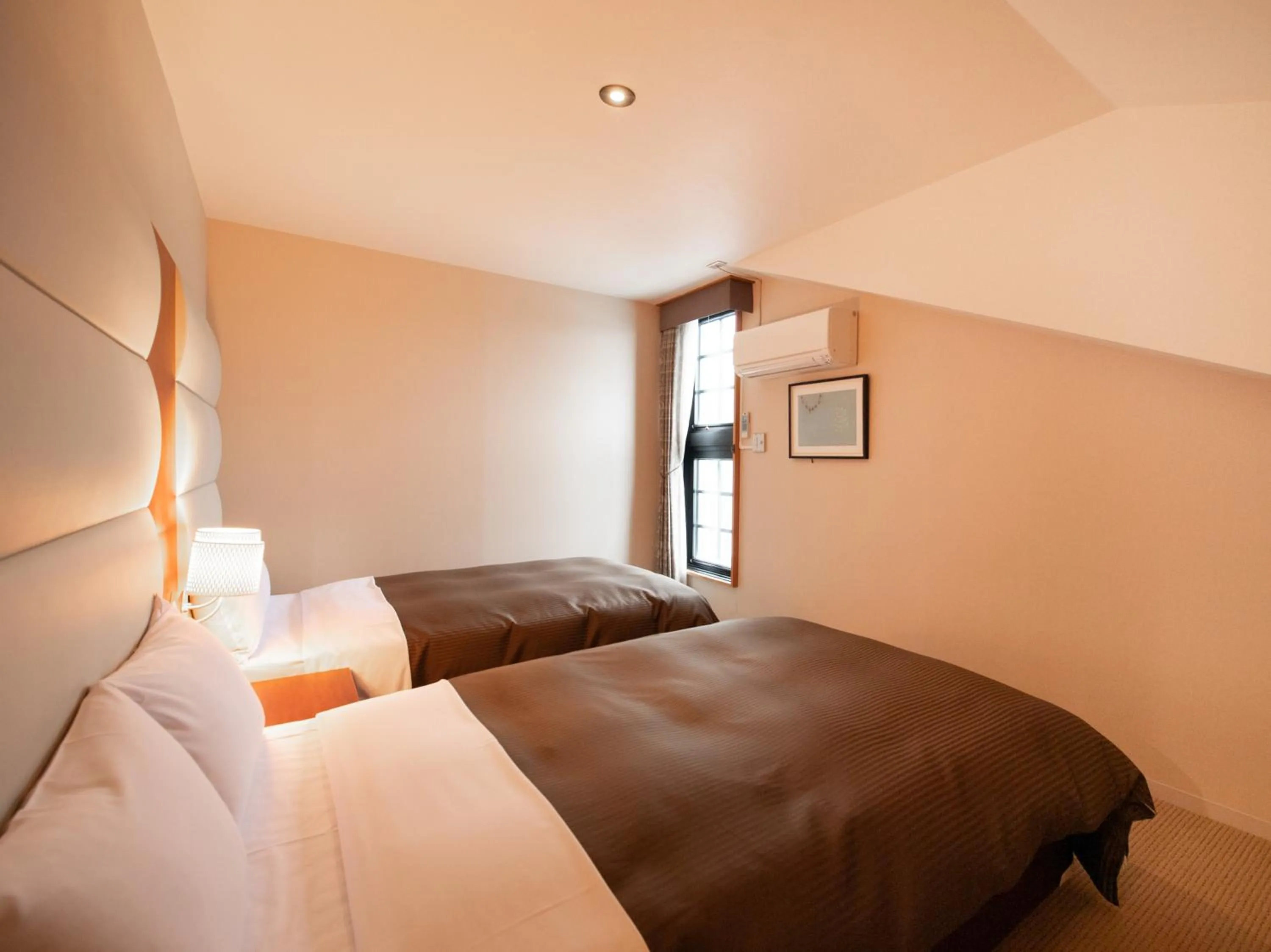 Bed in Tabist Hotel Colosseum Inn Tateshina