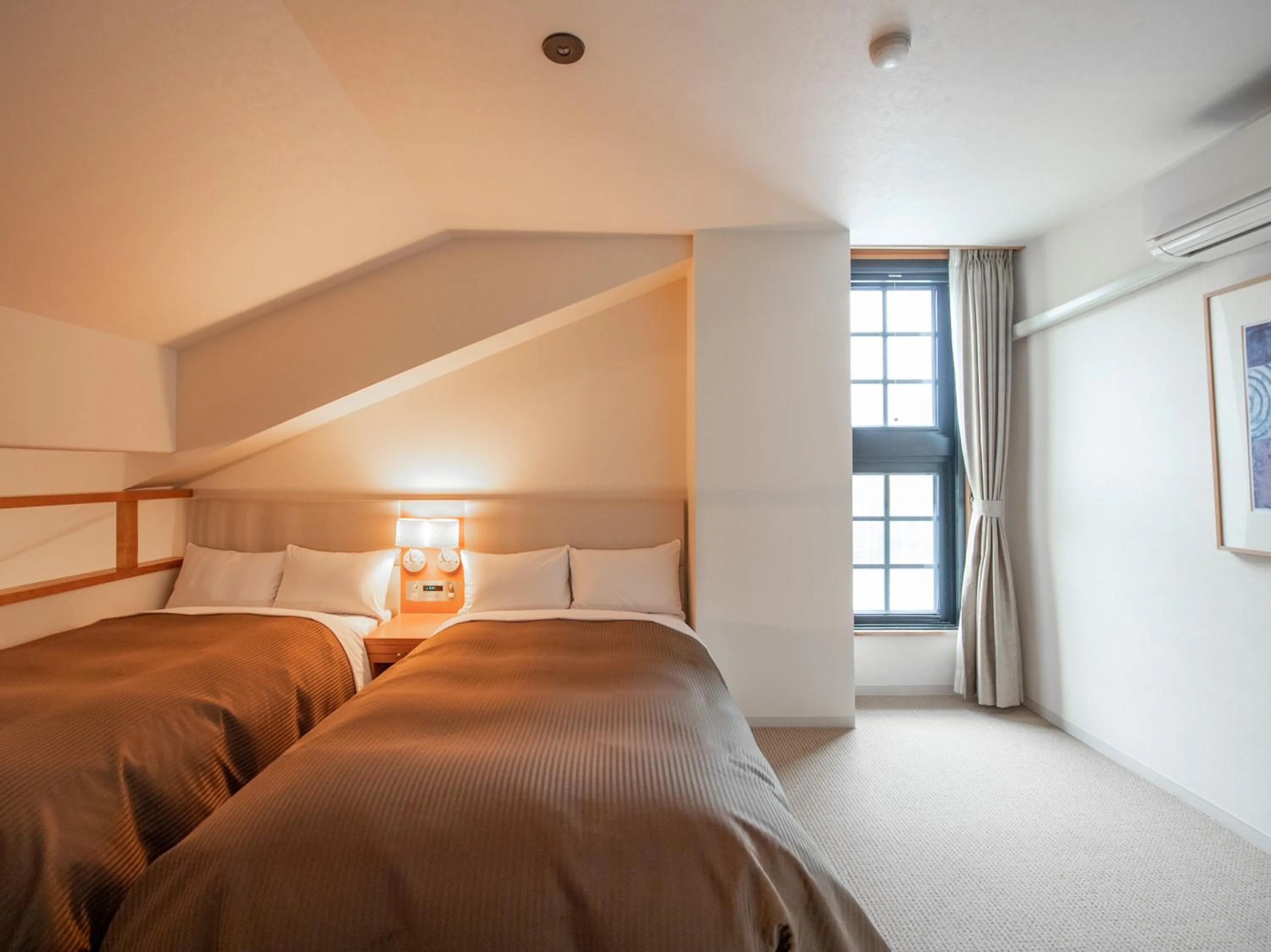 Bed in Tabist Hotel Colosseum Inn Tateshina