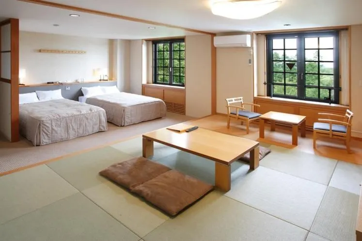 Bed in Tabist Hotel Colosseum Inn Tateshina