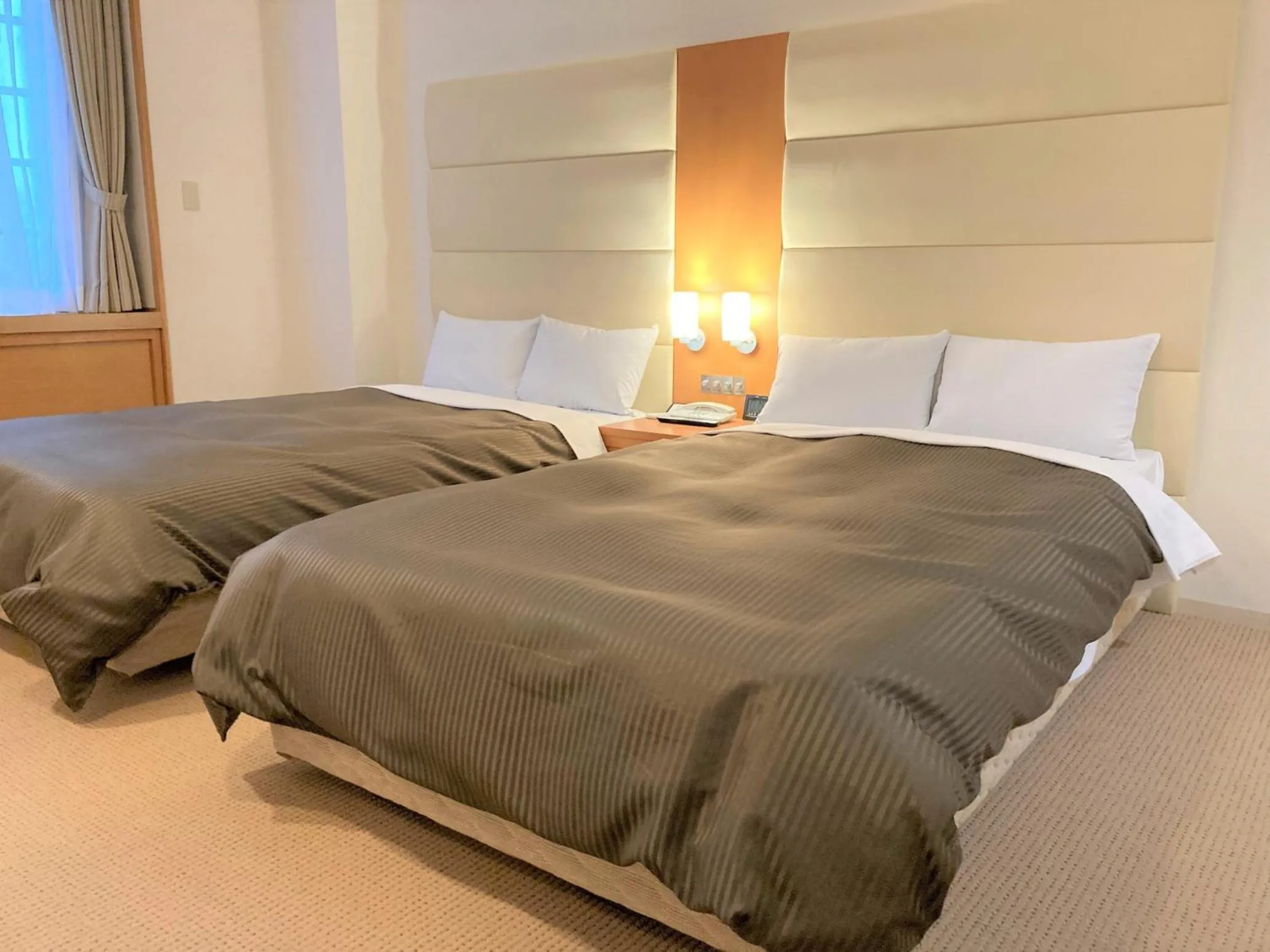 Bed in Tabist Hotel Colosseum Inn Tateshina