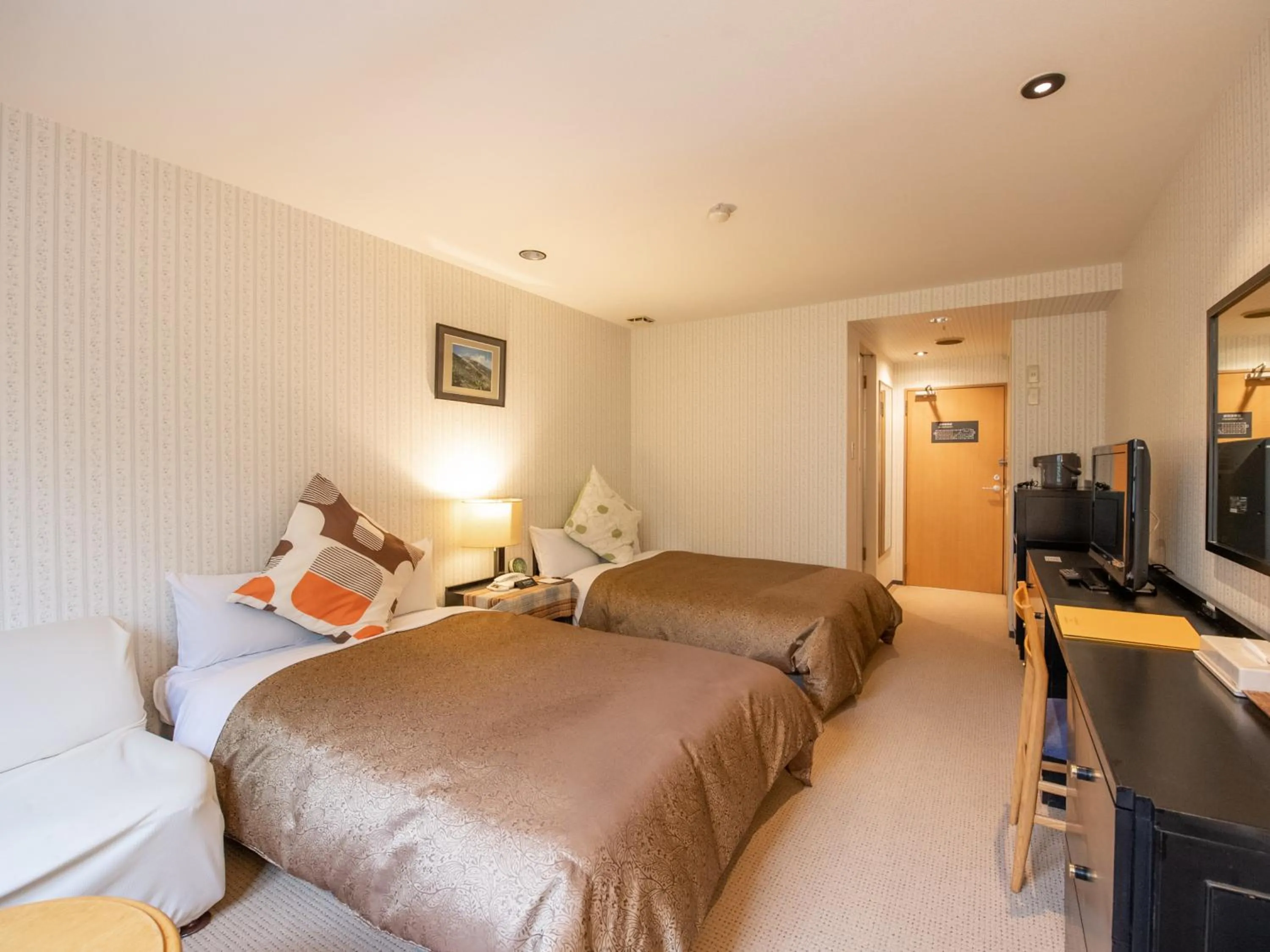 Bed in Tabist Hotel Colosseum Inn Tateshina