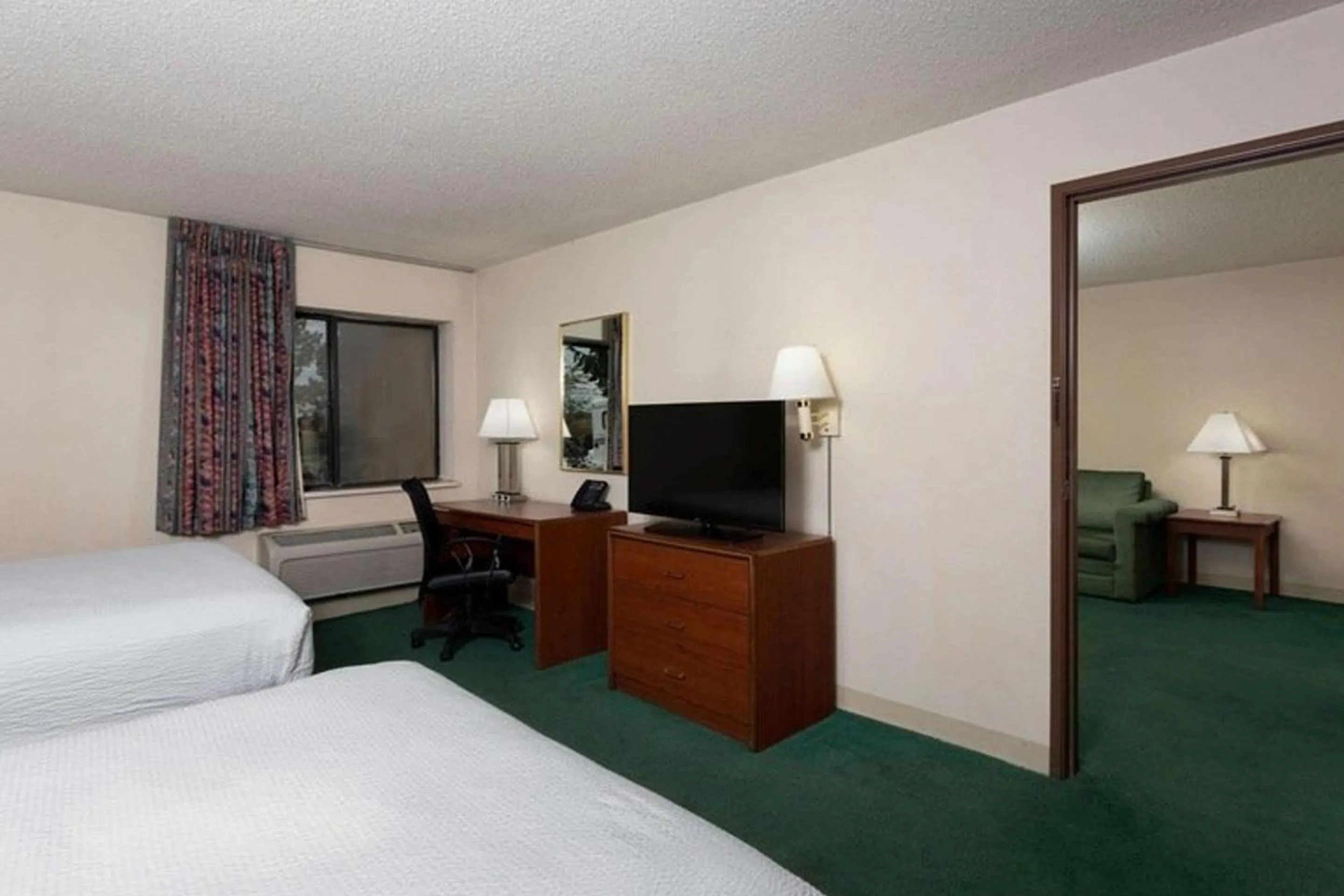 Bed in Norwood Inn & Suites Indianapolis East Post Drive