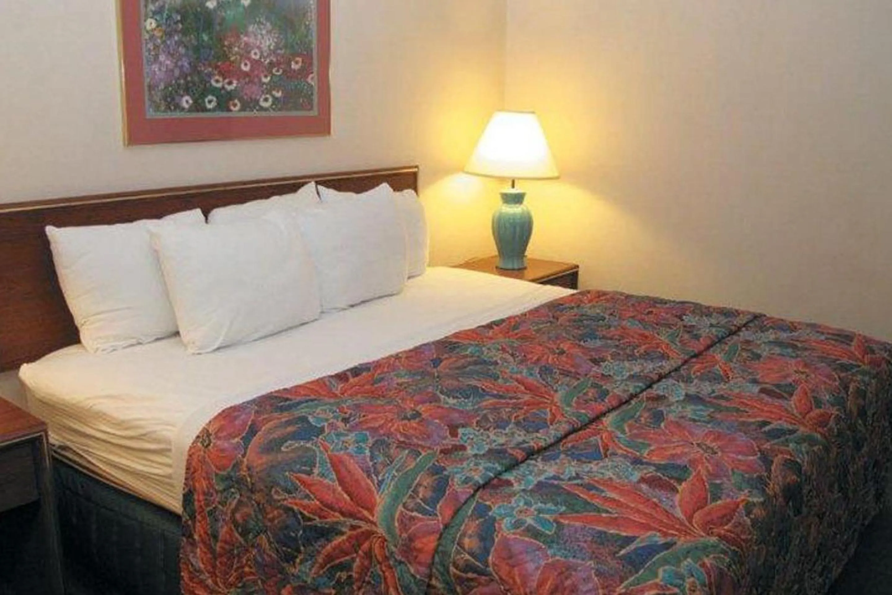 Bed in Norwood Inn & Suites Indianapolis East Post Drive