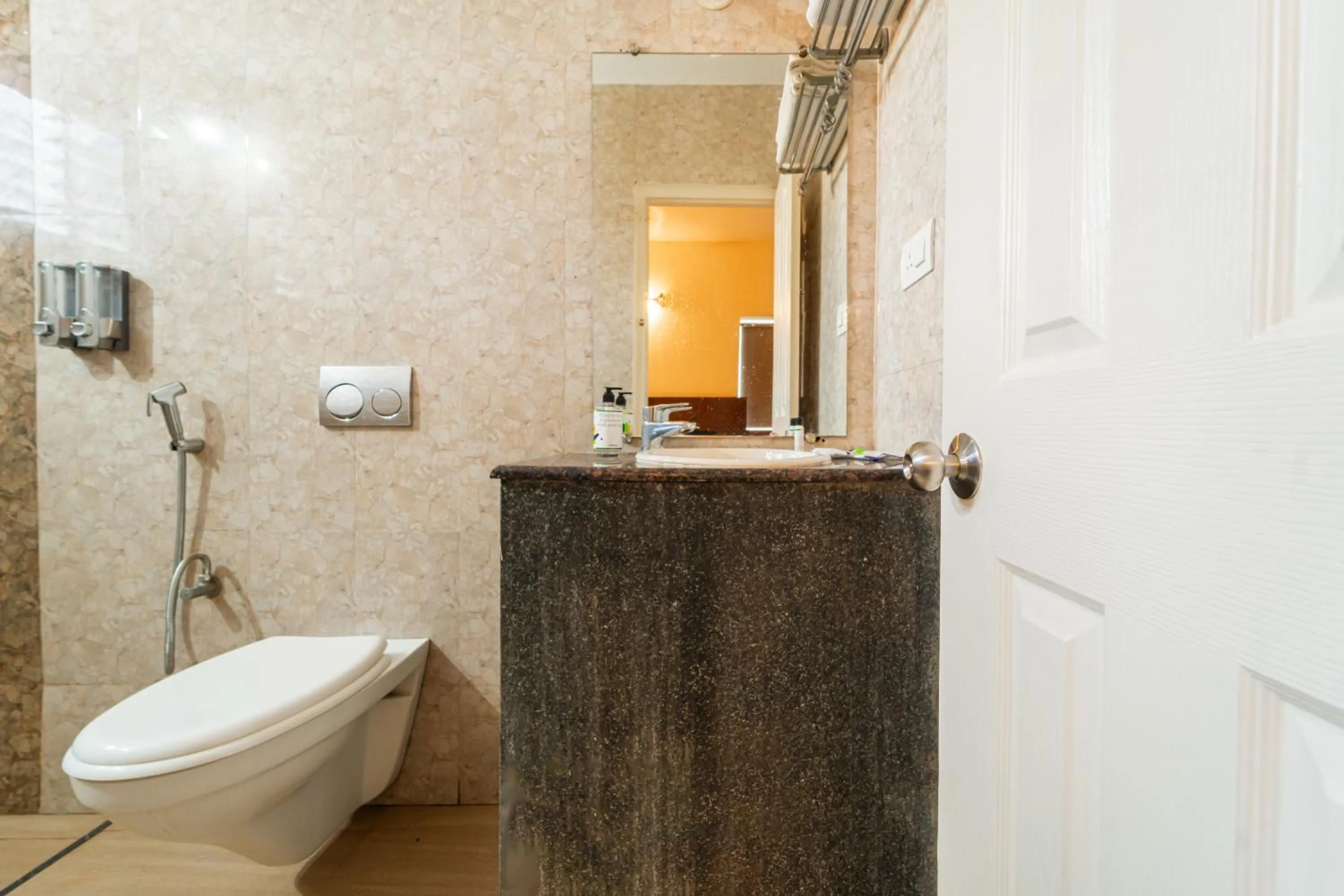 Toilet in Treebo Gulmohar Beach Resort with Pool