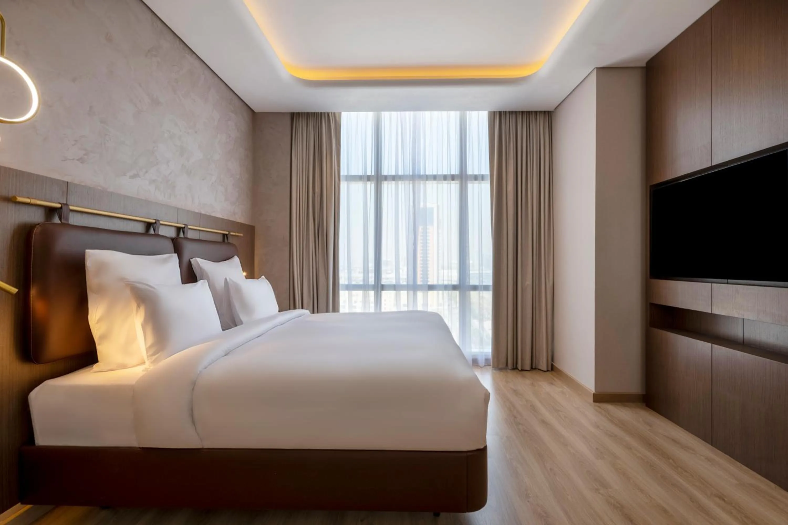 Bed in Movenpick Jumeirah Village Triangle