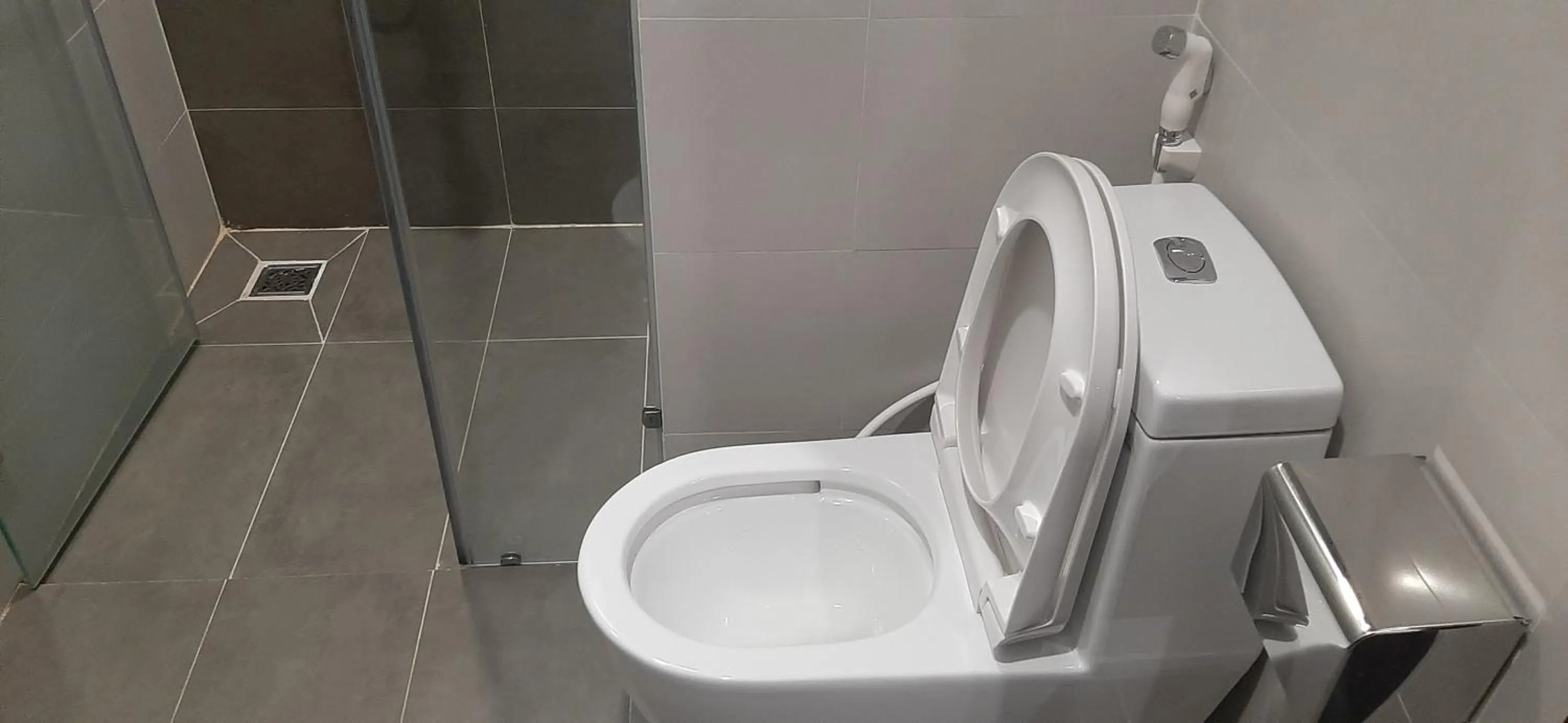 Bathroom in OYO 1161 Puchin Hotel And Apartment